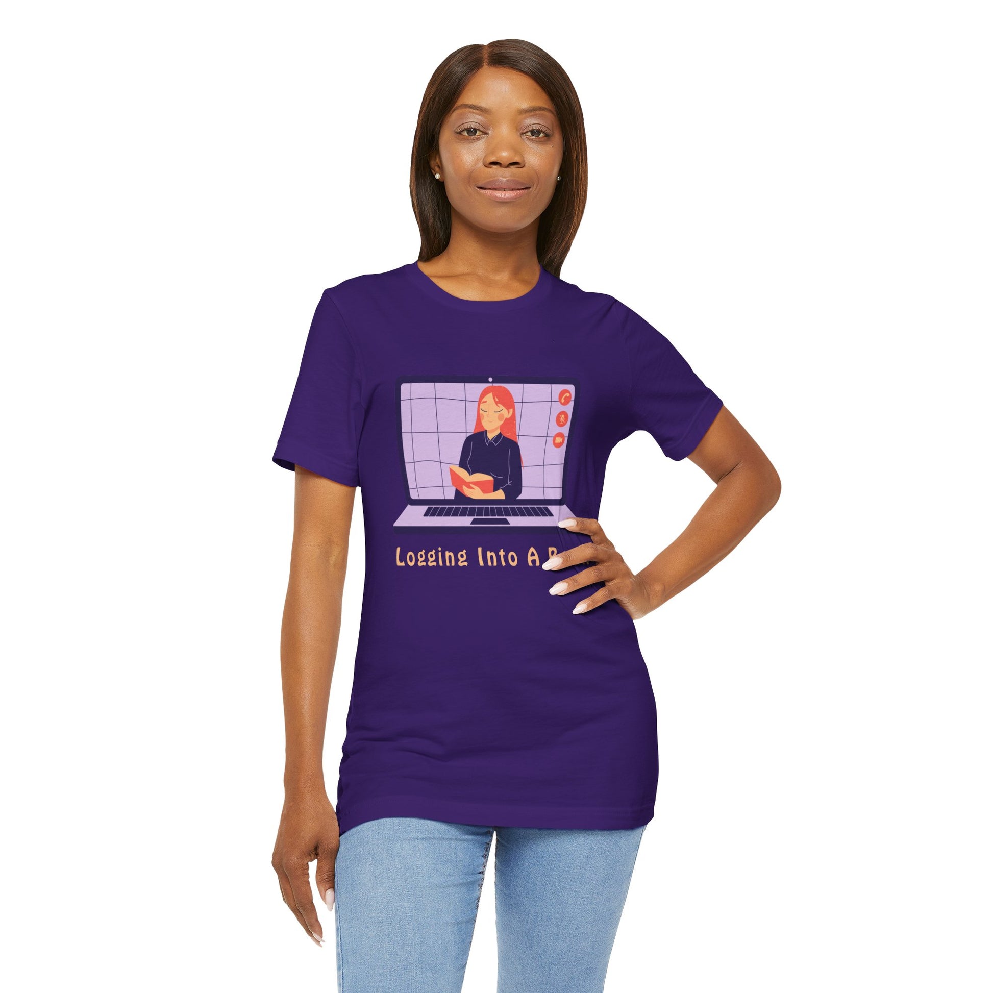 Woman wearing a purple t-shirt with open laptop featuring a woman reading a book and text 'Logging Into A Book' 