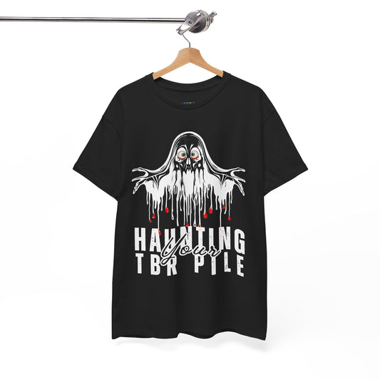 A black short-sleeve graphic T-shirt hanging on a wooden hanger against a white background. The shirt features a dripping white ghost graphic with red eyes and red blood-like drips, above the text 'HAUNTING TBR PILE' in white.