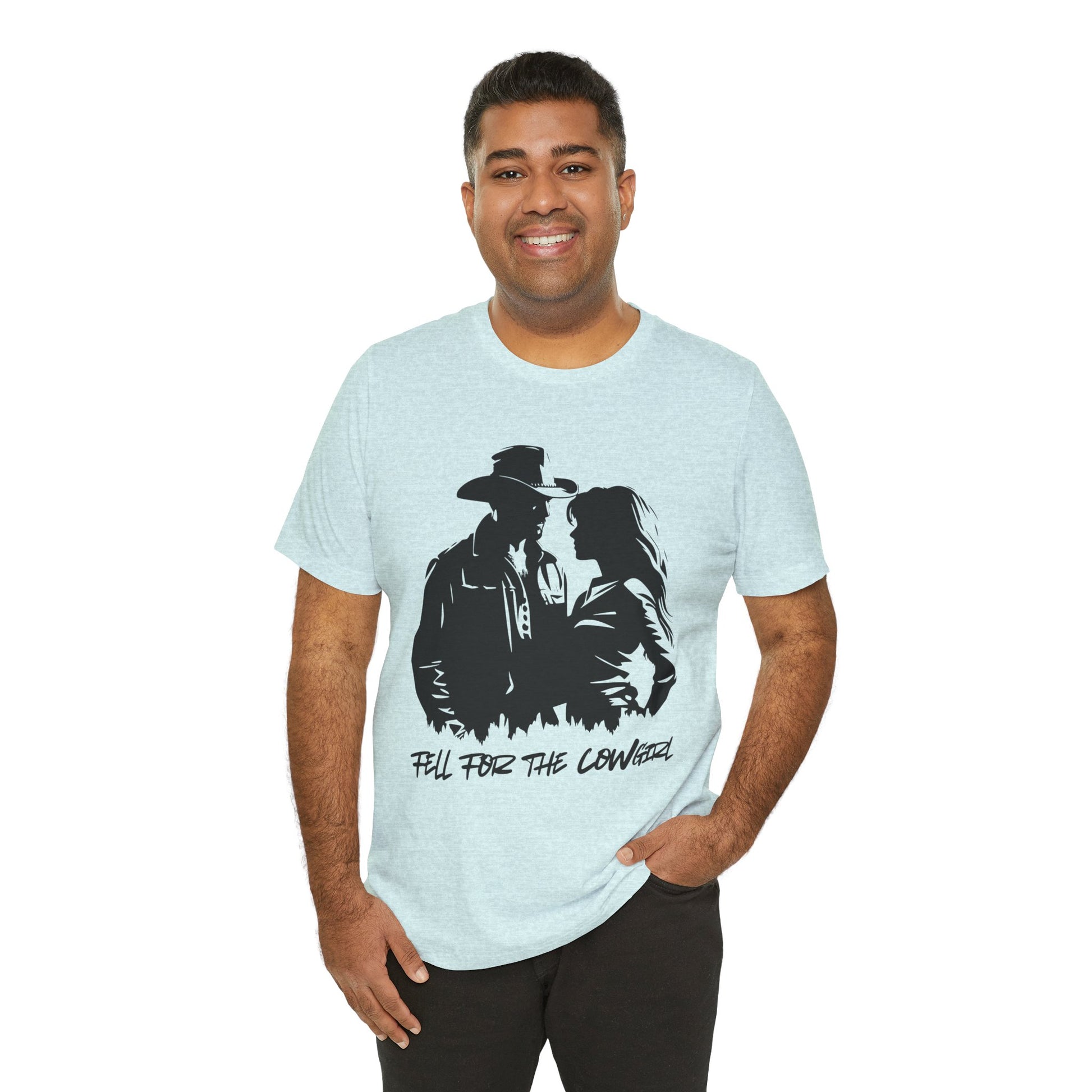 Man wearing a light blue t-shirt with black graphic of a man and a woman, text says 'Fell for the Cowgirl'