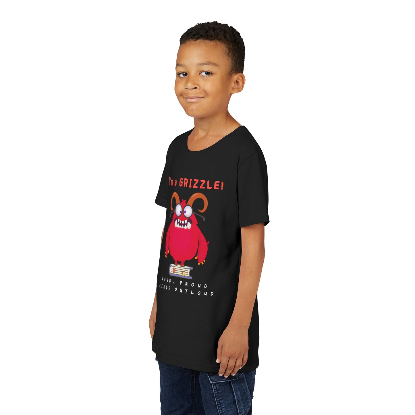 Boy wearing a black personality t-shirt with a red eye glass wearing monster standing on a book and announcing 'I'm a GRIZZLE!'