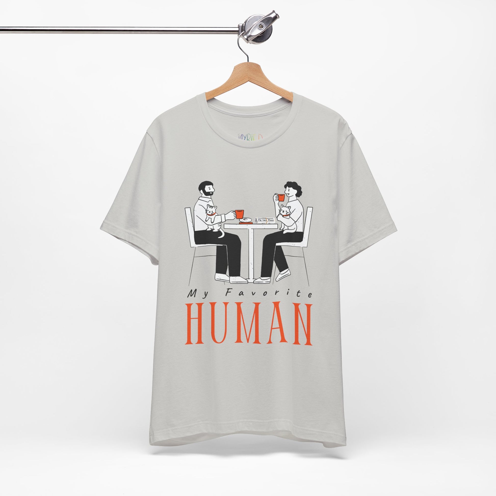 Gray t-shirt with a graphic of two people sitting at a table, newspaper in front of one, drinking hot beverages, holding cats and text 'My Favorite Human' 