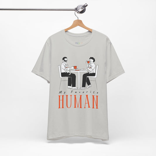 Gray t-shirt with a graphic of two people sitting at a table, newspaper in front of one, drinking hot beverages, holding cats and text 'My Favorite Human' 