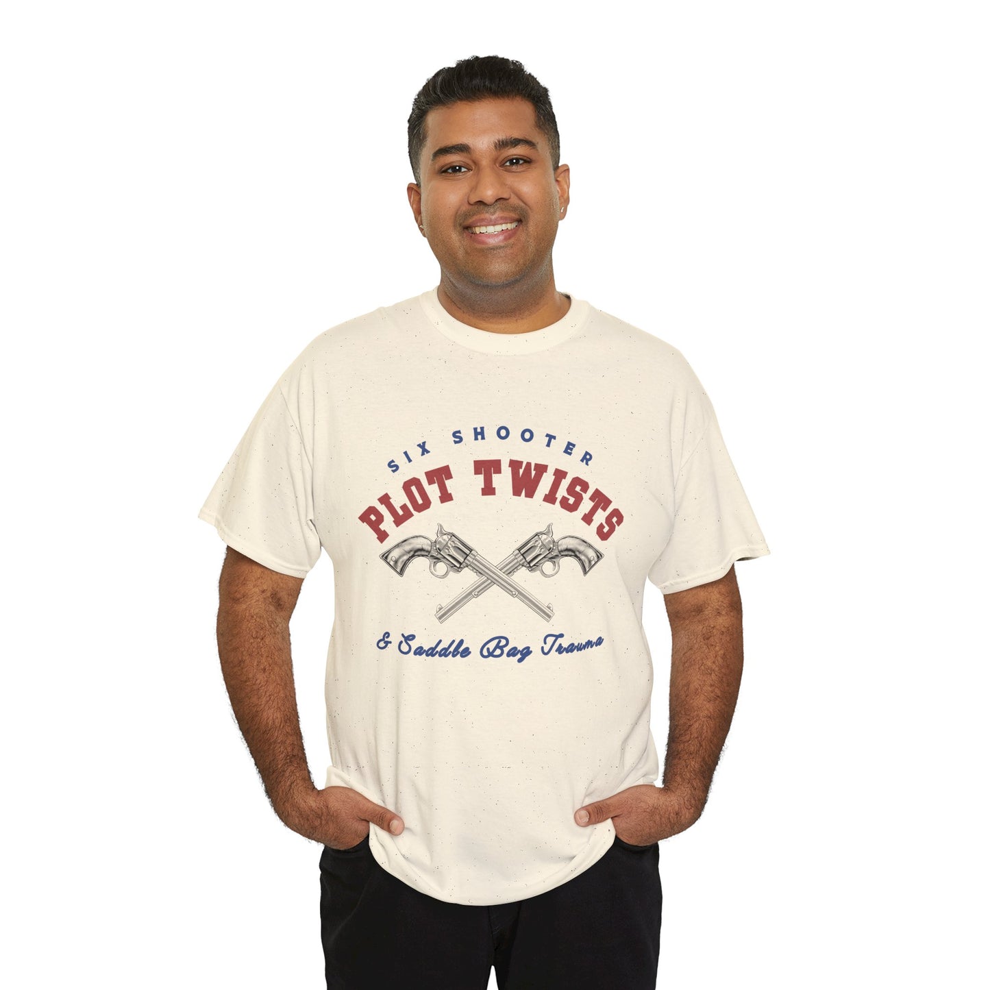 Man wearing a beige t-shirt with two pistols criss-crossed in the center and text 'Six Shooter Plot Twists & Saddle Bag Trauma'