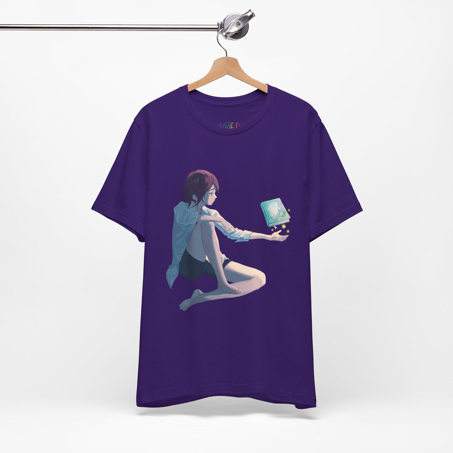Purple t-shirt with a fantasy illustration of a person holding their palm up as a book magically floats above it
