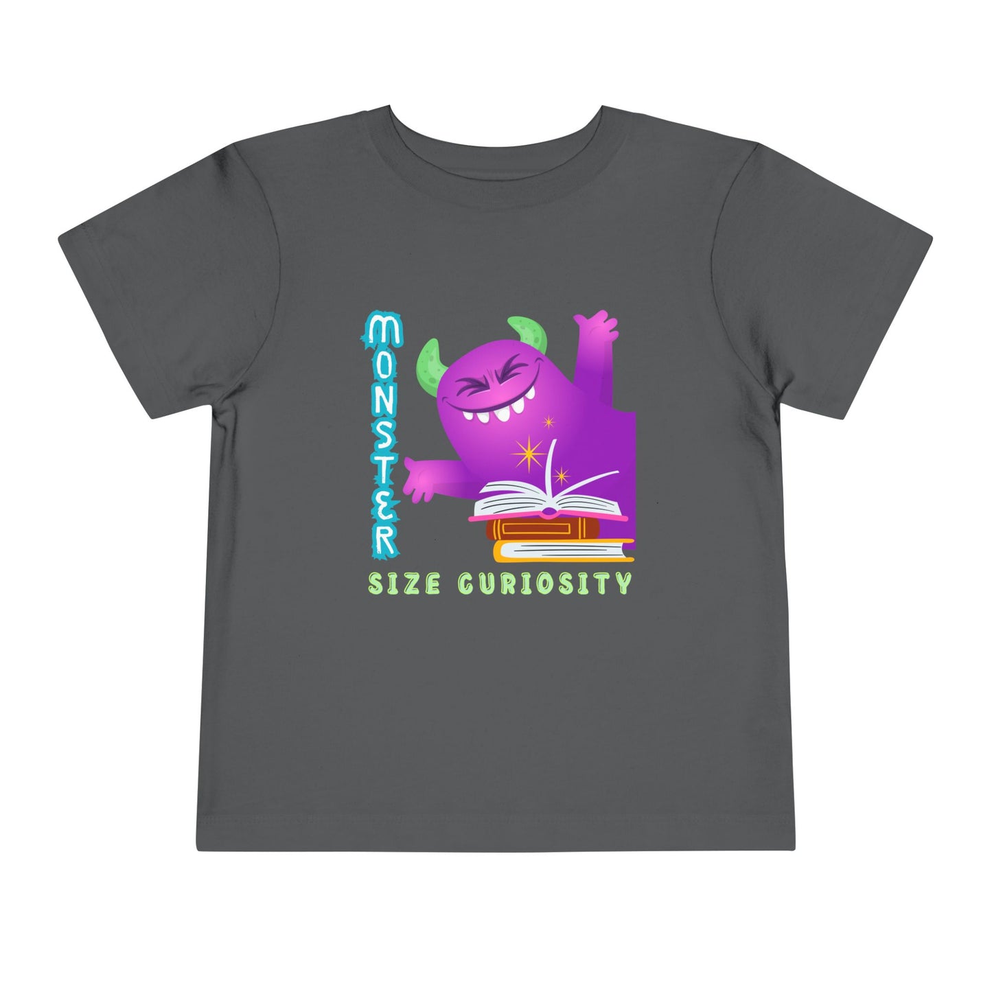 Gray t-shirt with a happy purple monster, a pile of books and text 'Monster Size Curiosity'