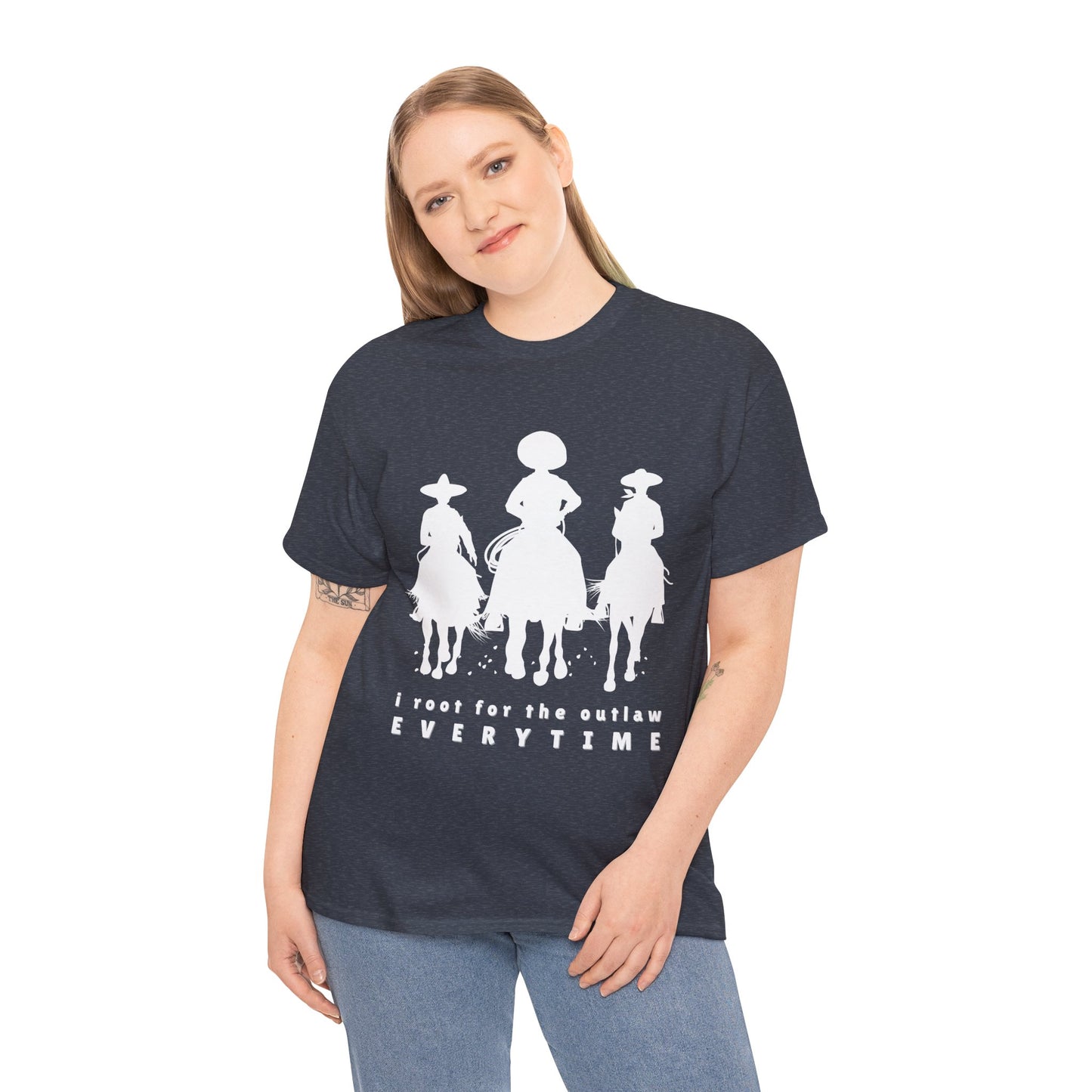 Woman wearing a heather navy t-shirt with white cowboys on horses and text 'I root for the outlaw EVERYTIME'