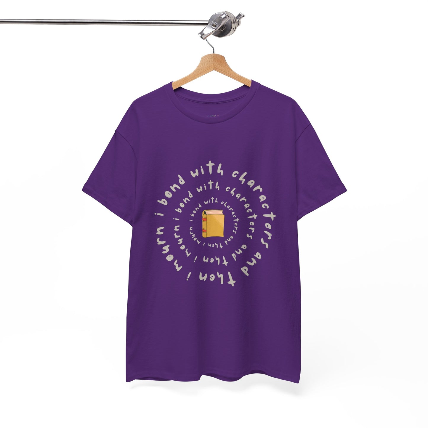 Purple blue t-shirt with a small book at the center and layered spiral text 'I Bond With Characters & Then I Mourn'