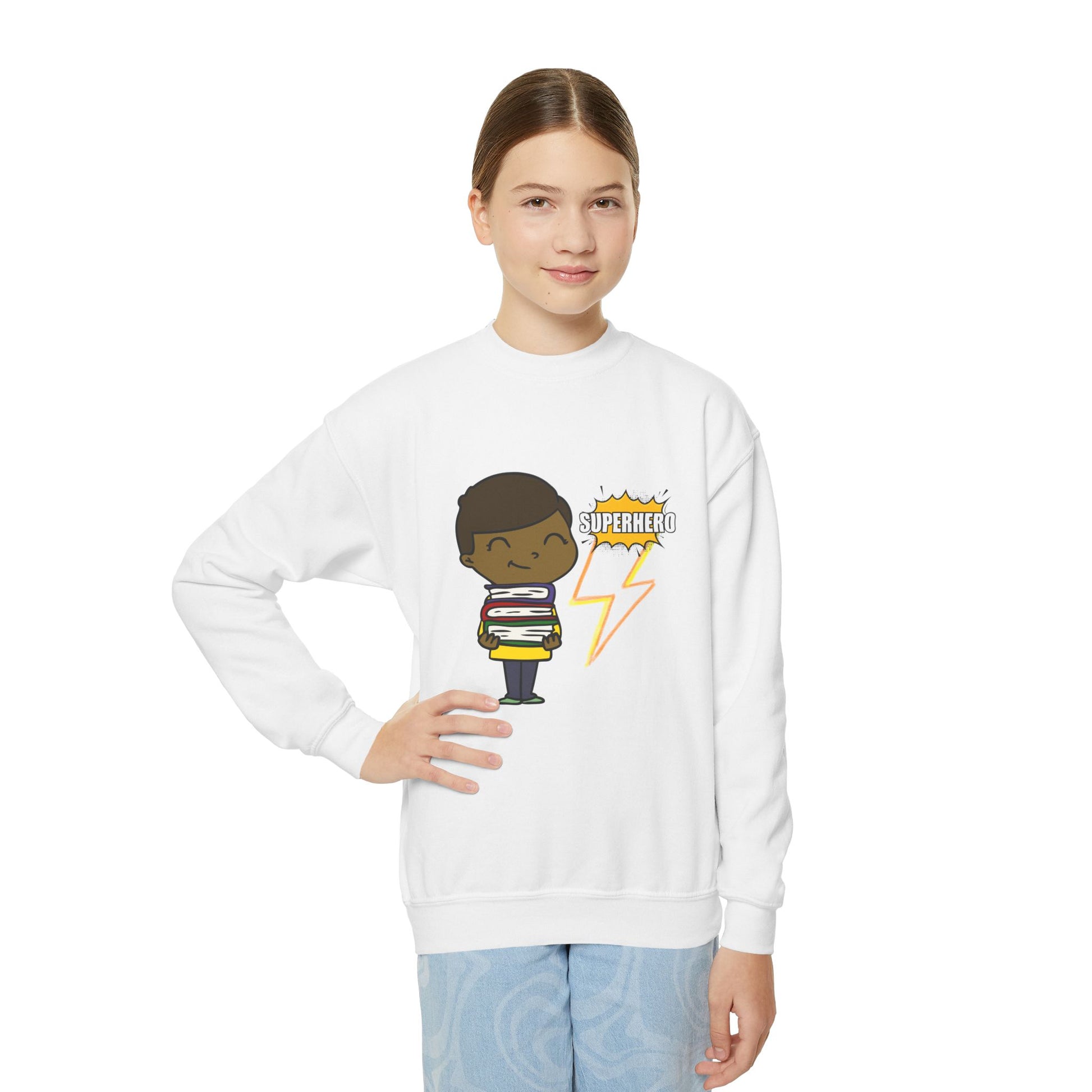 Girl wearing a white sweatshirt with a cartoon kid holding a stack of books and a lightning bolt with text 'Superhero' 