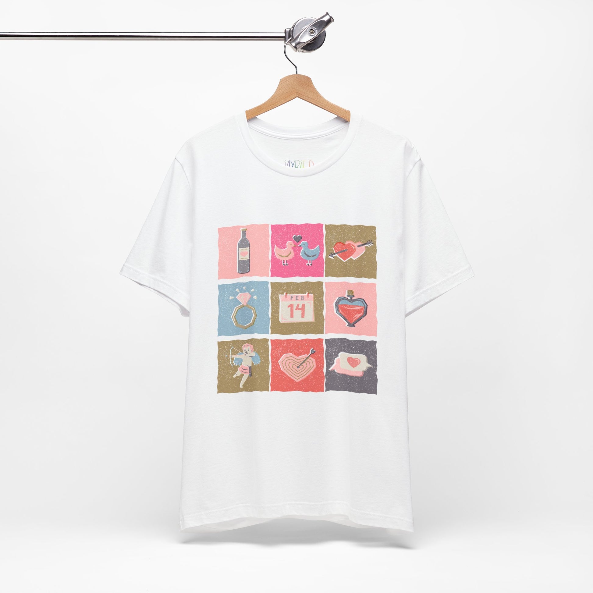 White t-shirt with colorful graphic design of Valentine's Day images stacked in blocks