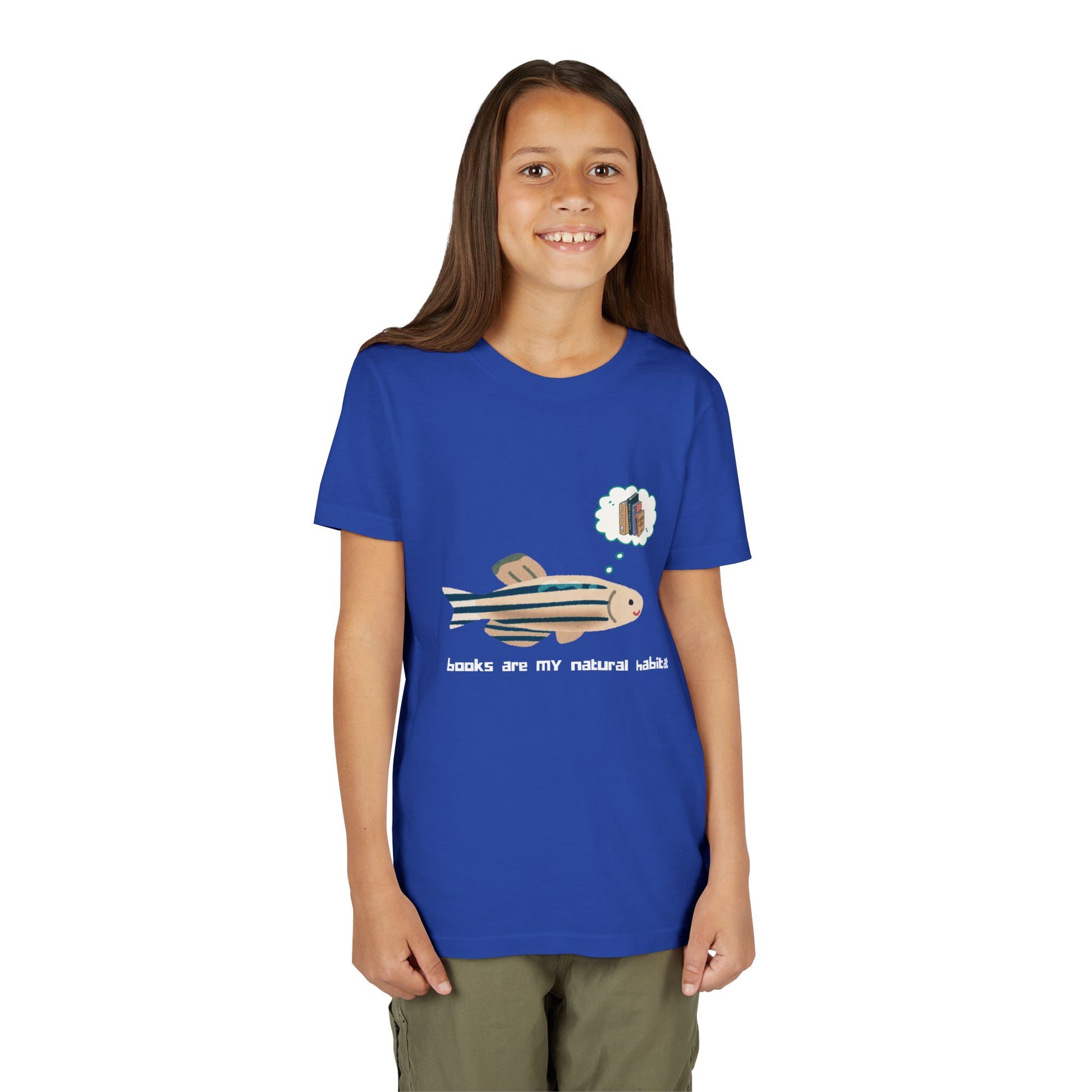 Girl wearing a blue t-shirt with a fish graphic, thought bubble of books and text 'books are my natural habitat'