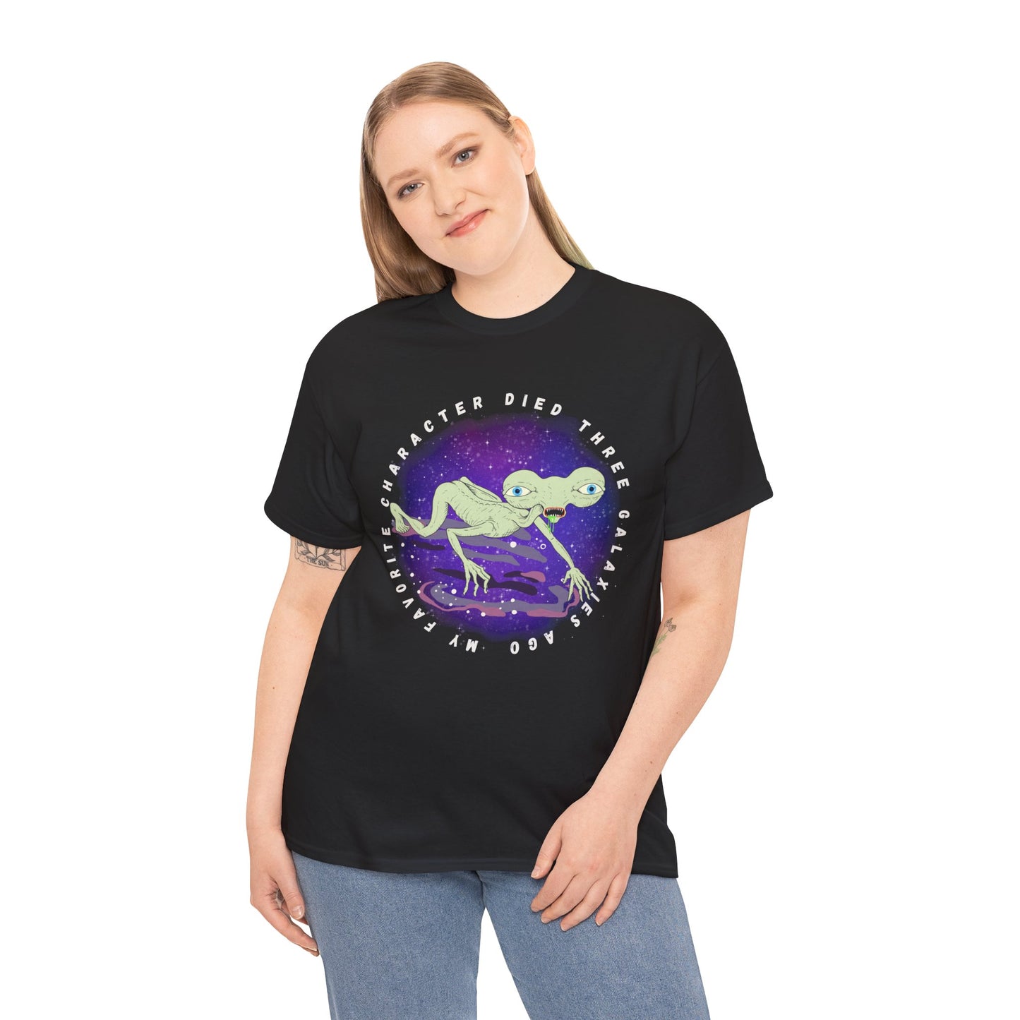 Woman wearing a black t-shirt with sickly alien crawling on it's knees and text 'My Favorite Character Died Three Galaxies Ago' 