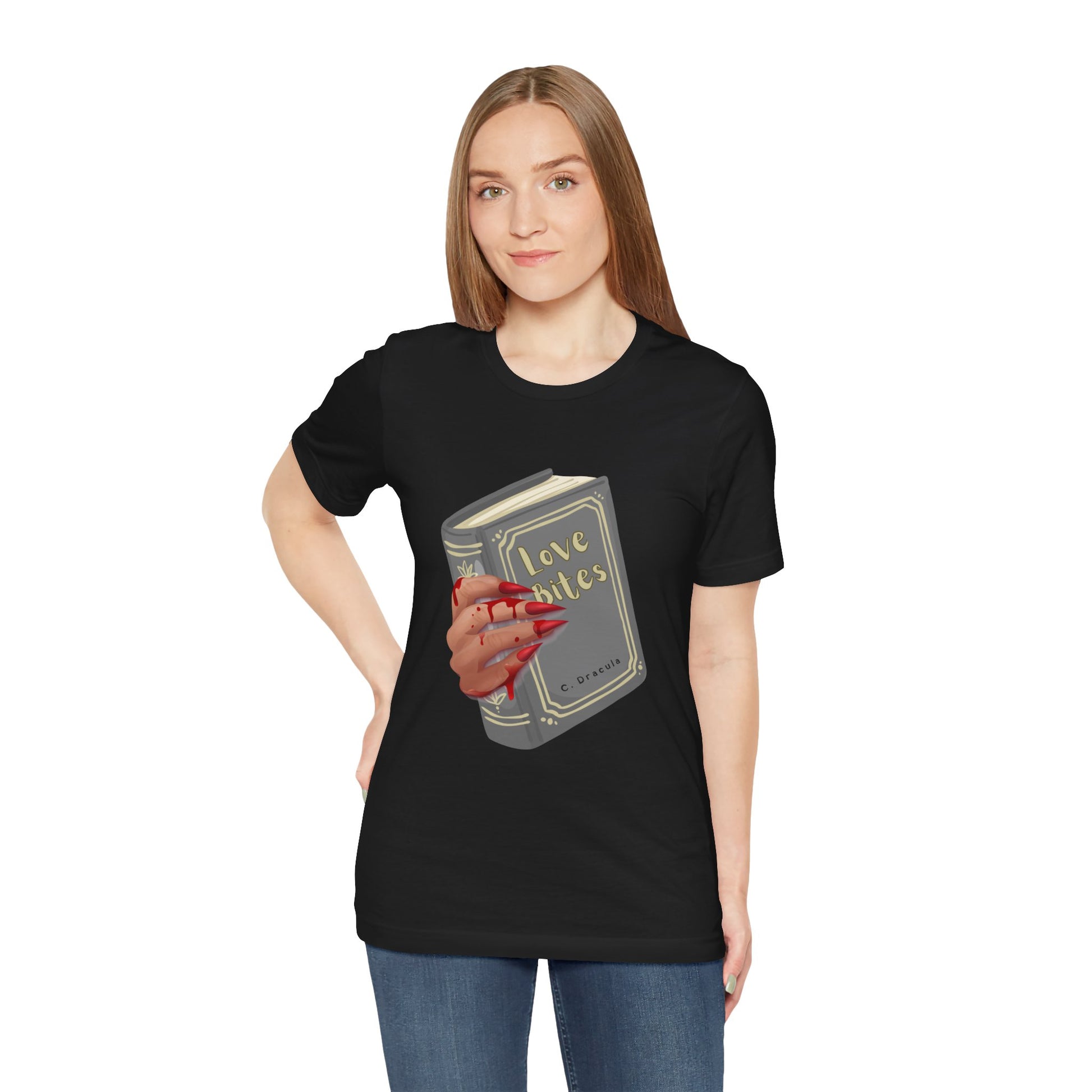 Woman wearing a black t-shirt with graphic design of a creepy and bloody hand holding a book titled 'Love Bites' by C. Dracula