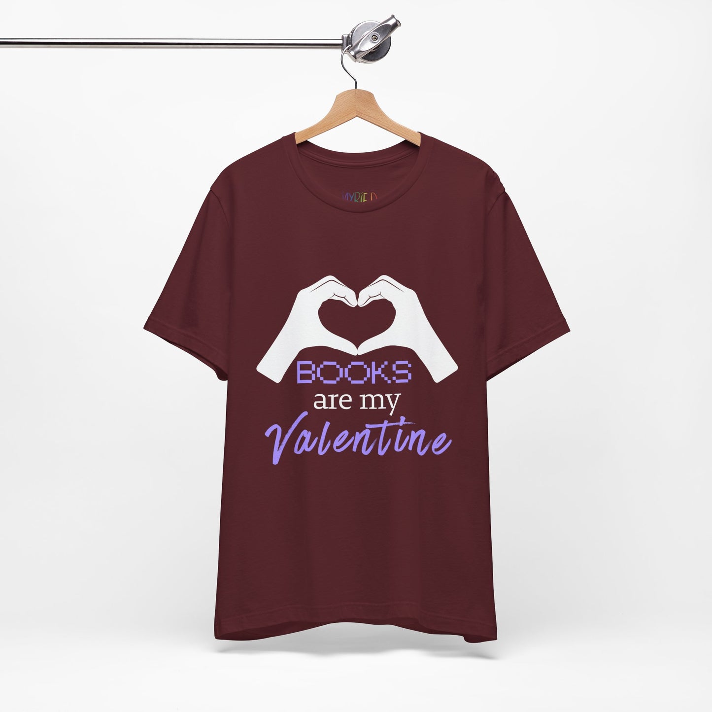Maroon t-shirt with 'Books are my Valentine' design on two hands making a heart shape 