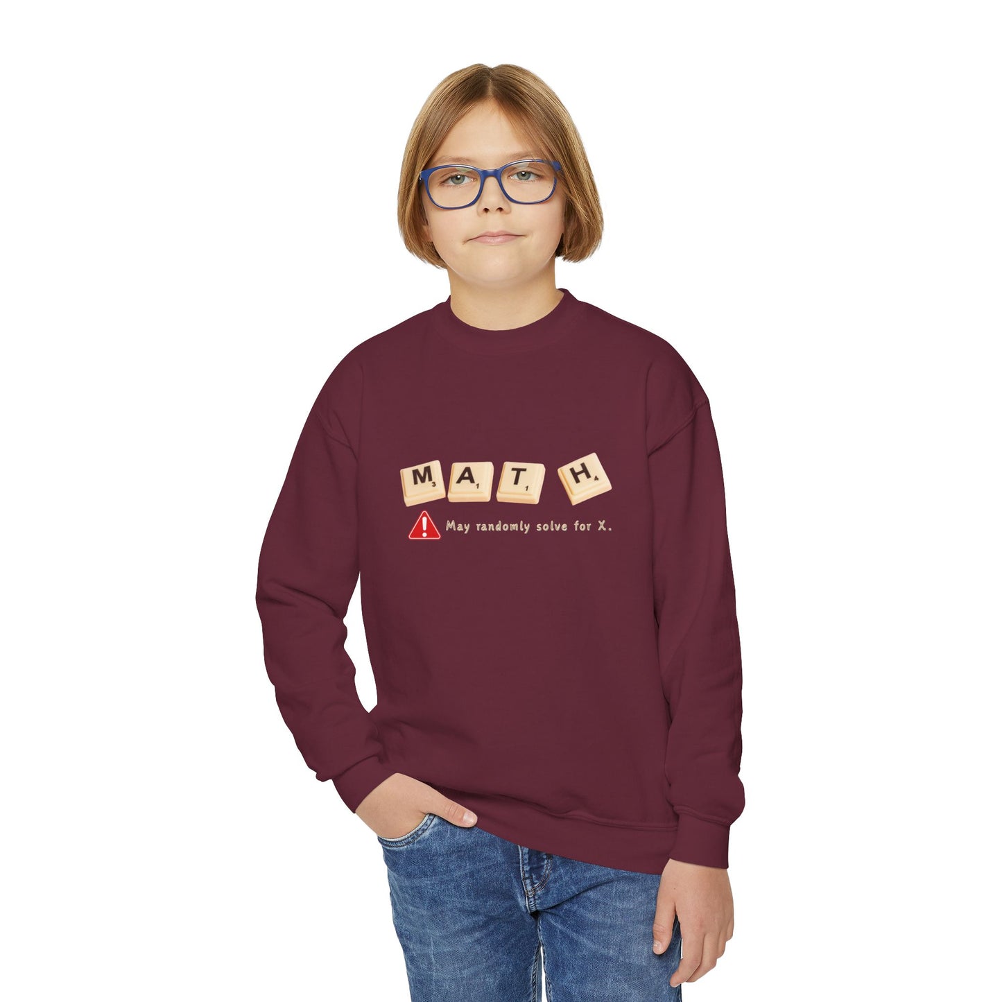 Boy wearing a maroon sweatshirt with 'MATH' game tiles and text 'May randomly solve for x'