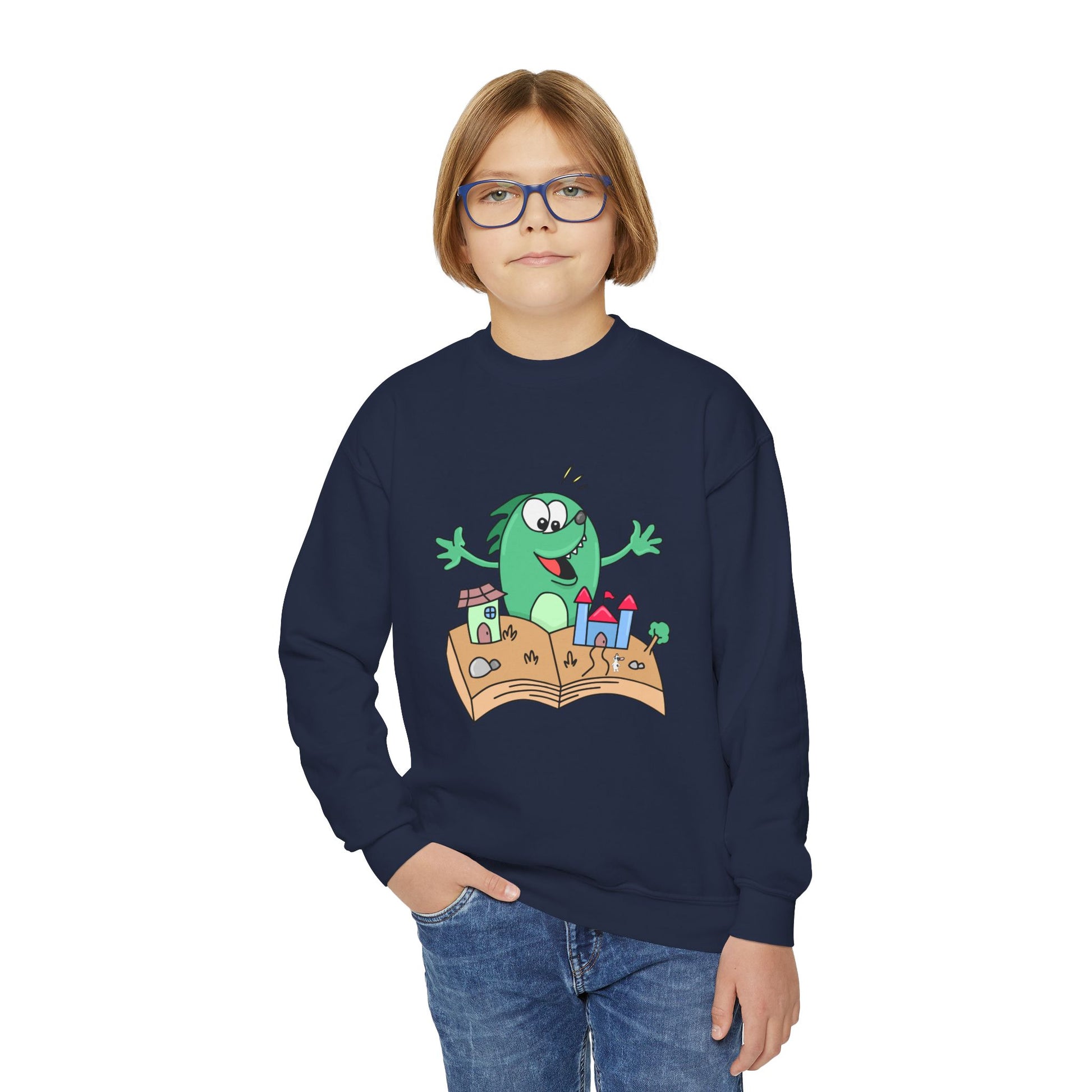 Boy wearing a navy blue sweatshirt with a cartoon dog excited about a 3D book