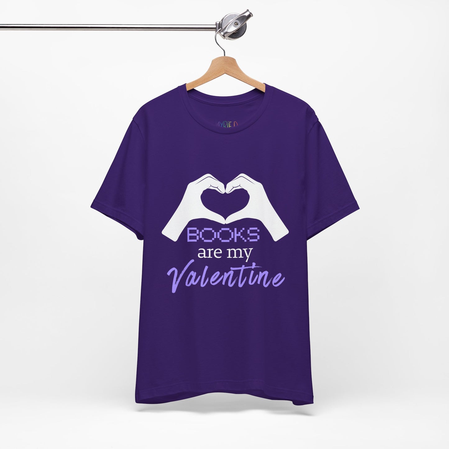 Purple t-shirt with 'Books are my Valentine' design on two hands making a heart shape 