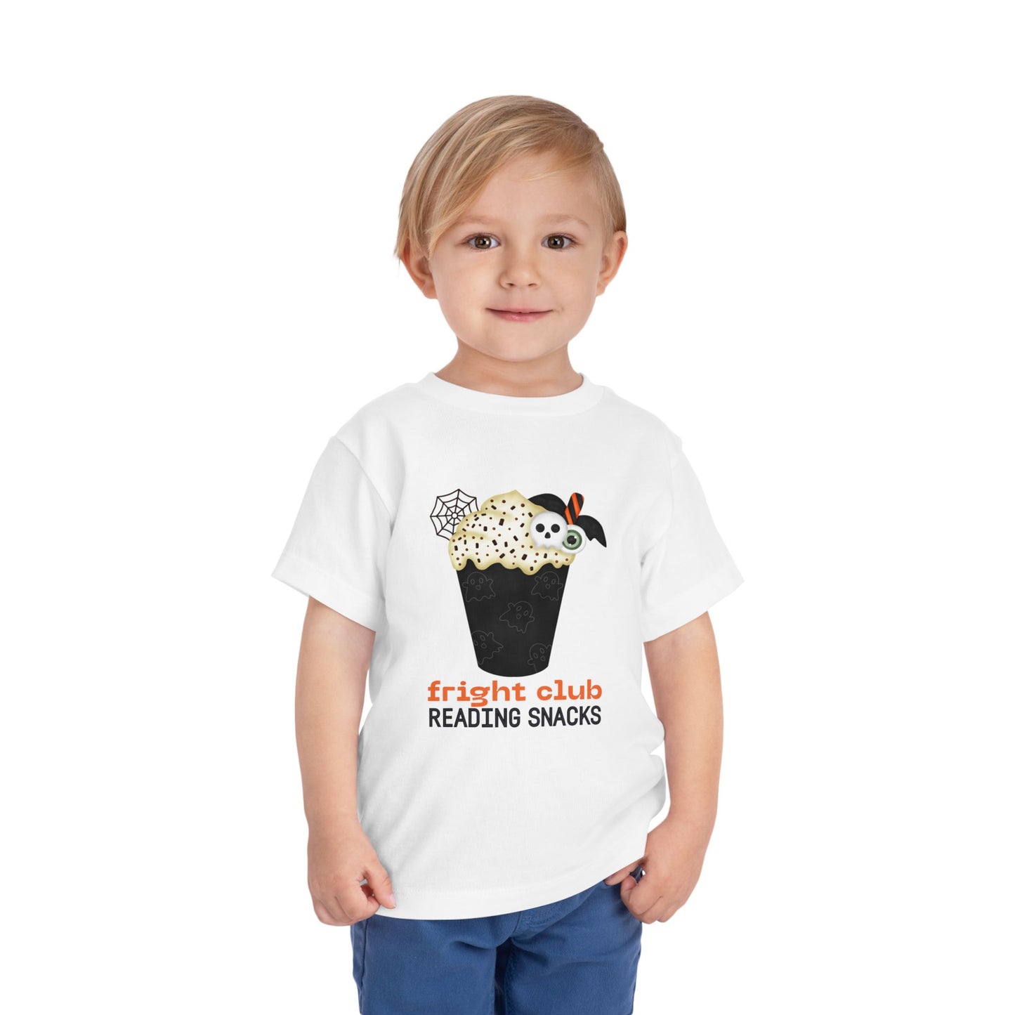 Child wearing a white t-shirt with Halloween-themed  foamy beverage design and text "fright club reading snacks' on a white background