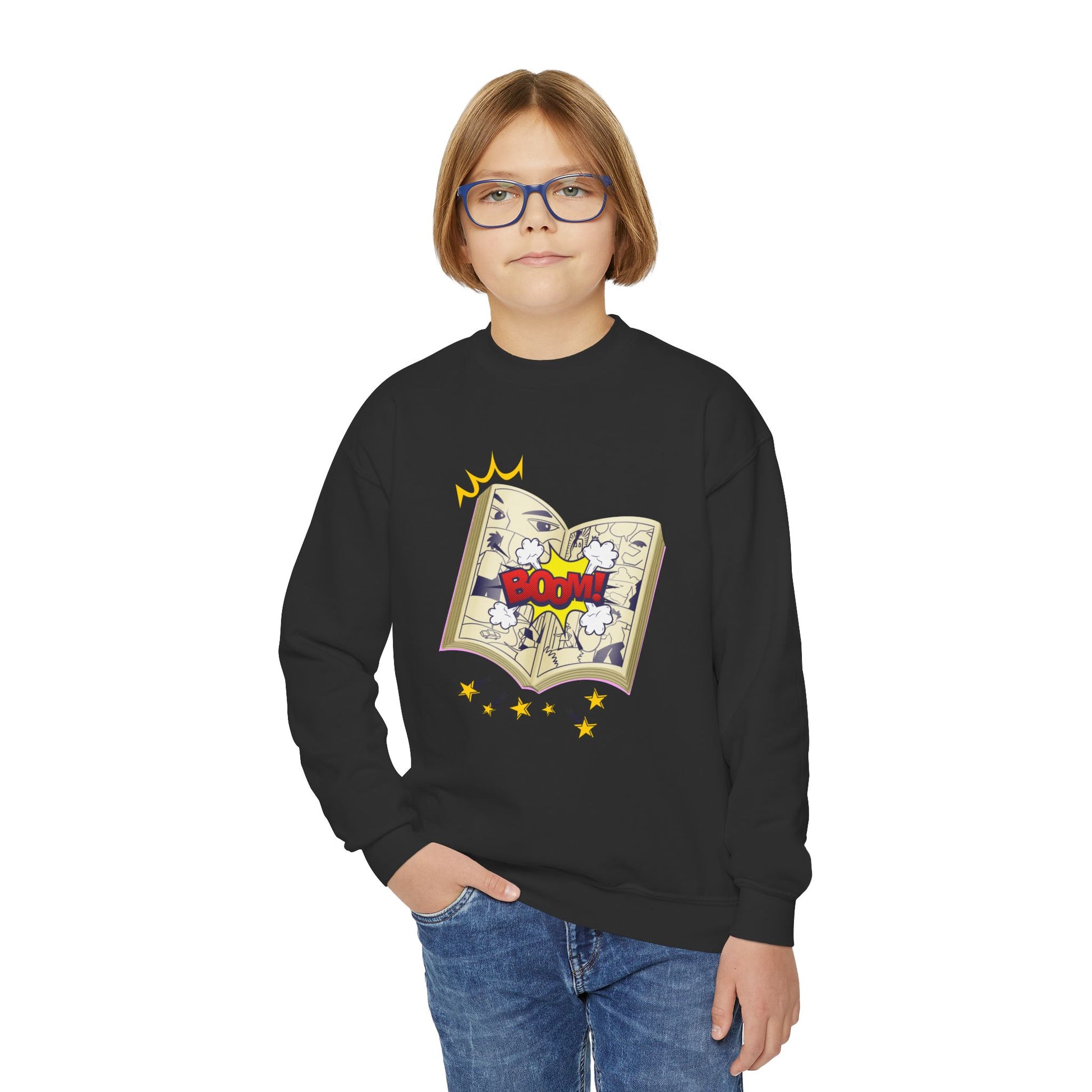 Boy wearing a black sweatshirt with a graphic of an open comic book with stars and 'BOOM!' text 