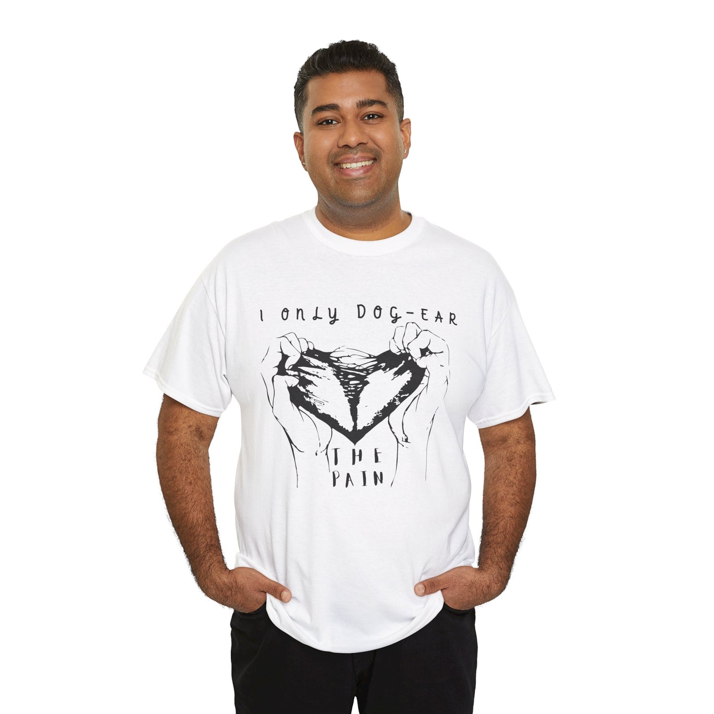 Man wearing a white t-shirt with black graphic of hands tearing apart a heart and text 'I Only Dog-Ear The Pain'