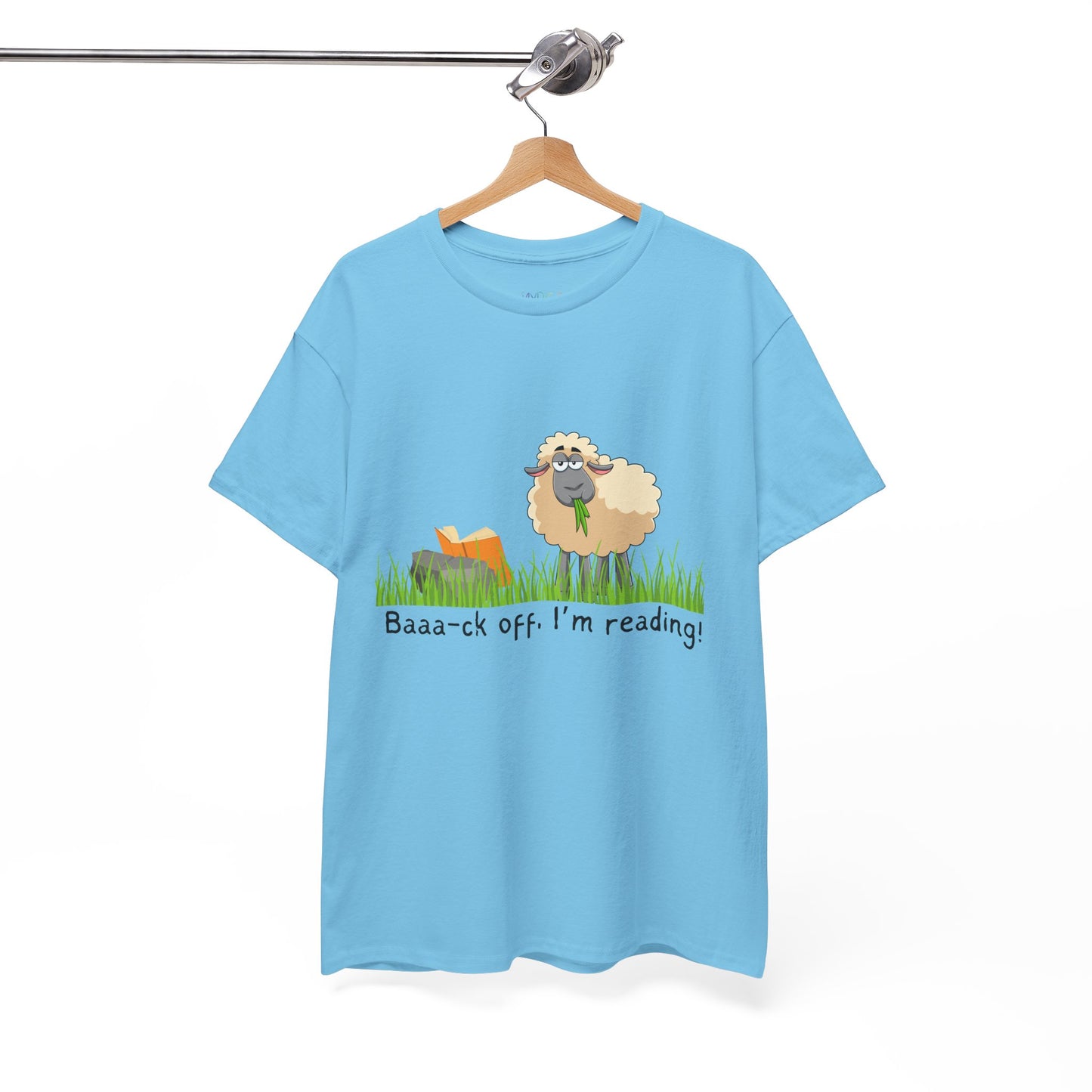 blue t-shirt with a sheep munching grass and reading a book propped up on a rock, text 'Baaa-ck off. I'm Reading!'