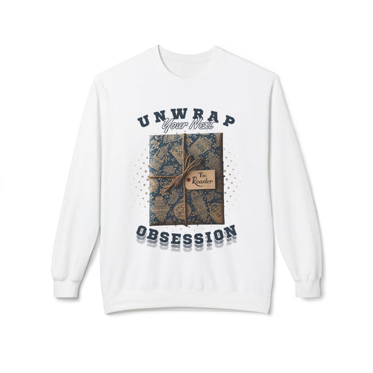 White sweatshirt with graphic design of a wrapped gift, a gift tag 'To Reader' and text 'unwrap your next obsession'