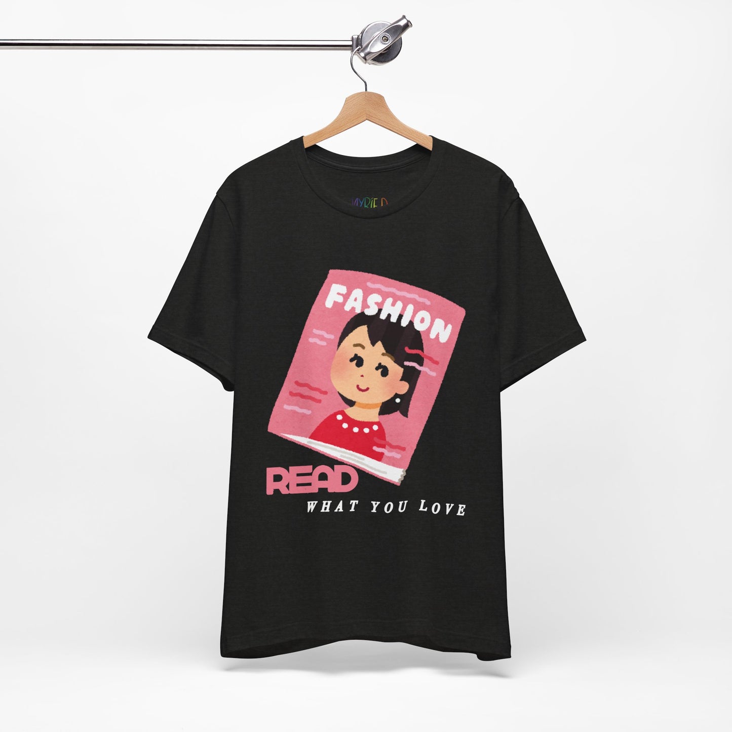 Black t-shirt with a graphic design of a girl on a fashion magazine and text 'Read What You Love' 