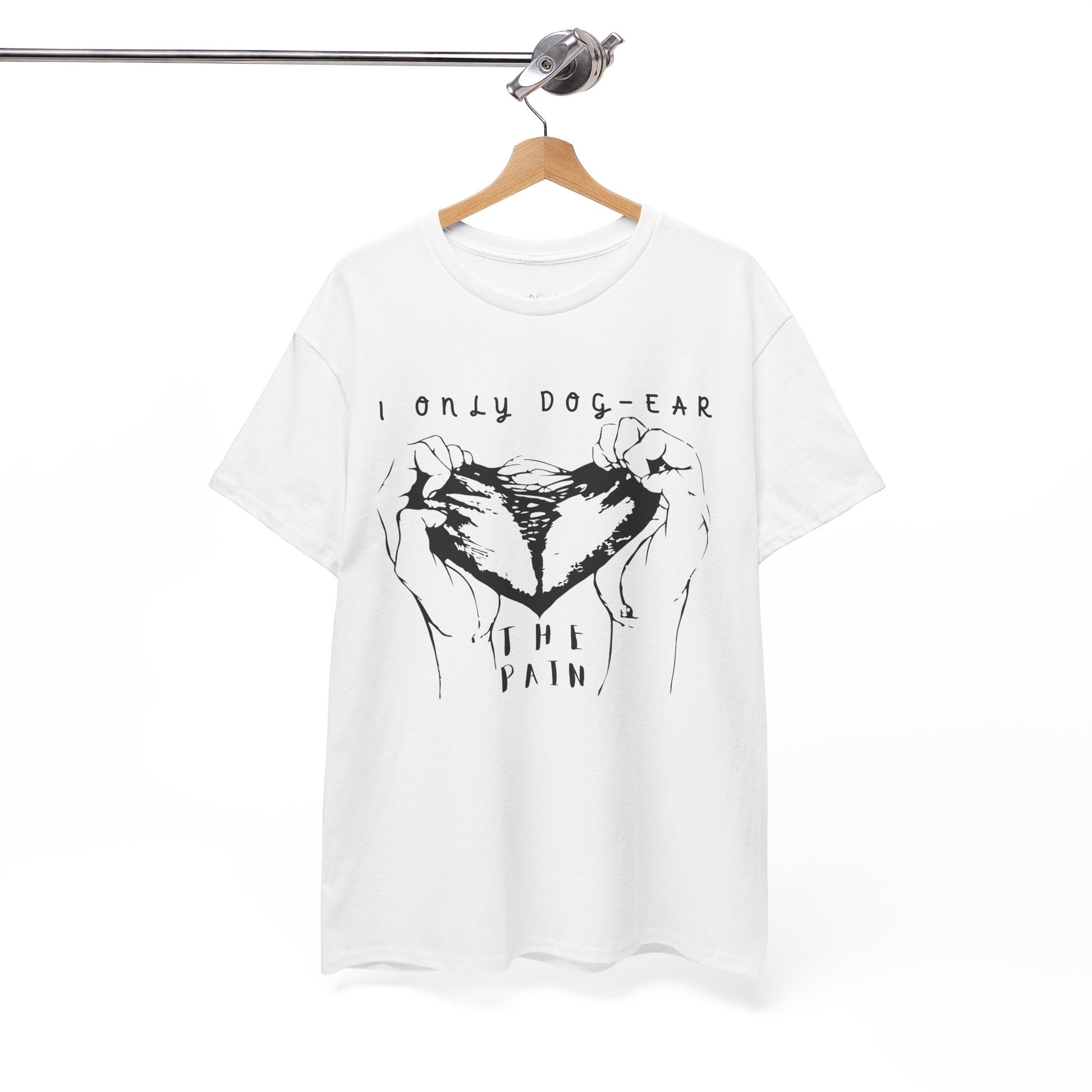 White t-shirt with black graphic of hands tearing apart a heart and text 'I Only Dog-Ear The Pain'