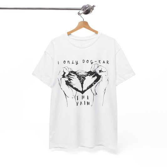White t-shirt with black graphic of hands tearing apart a heart and text 'I Only Dog-Ear The Pain'