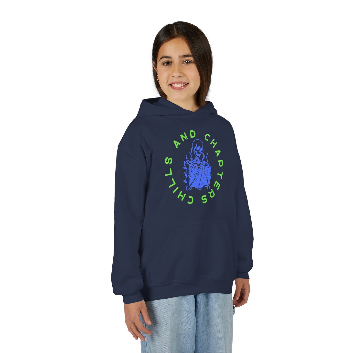 Girl wearing a navy blue hoodie with a skeleton reading a book graphic design and circular text 'CHILLS AND CHAPTERS'