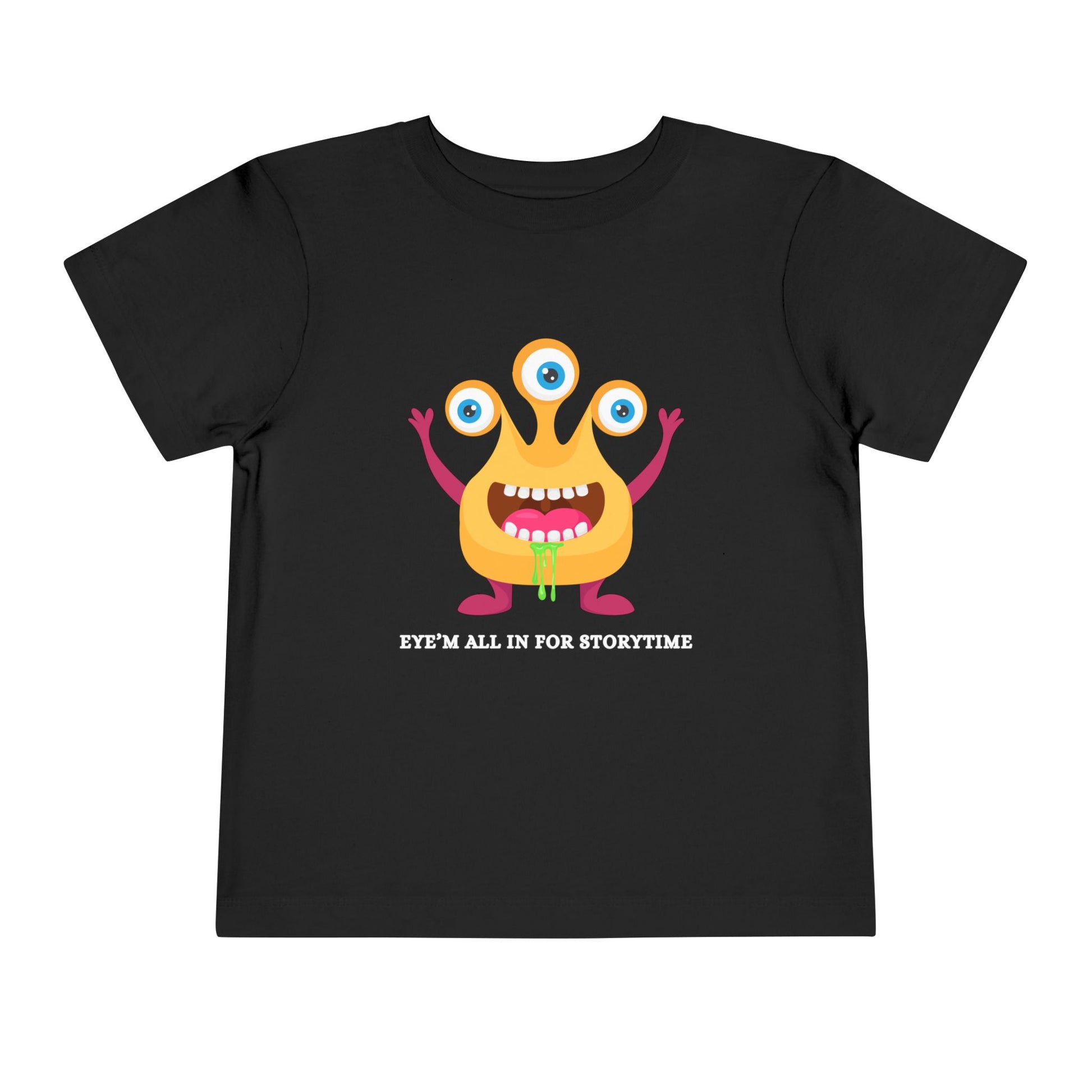 Black toddler t-shirt with a drooling, three-eyed monster graphic and text 'Eye'm all in for storytime' on a white background