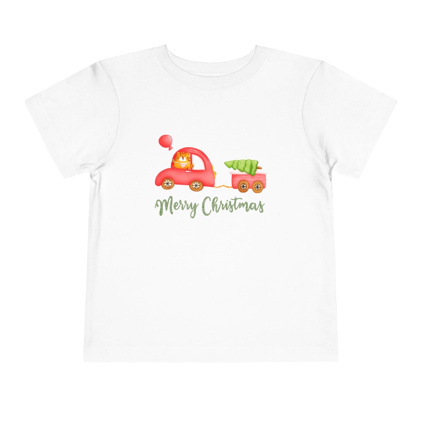 White toddler t-shirt with a tiger driving a red car, pulling a tailer with a Christmas tree and text 'Merry Christmas' on a white background