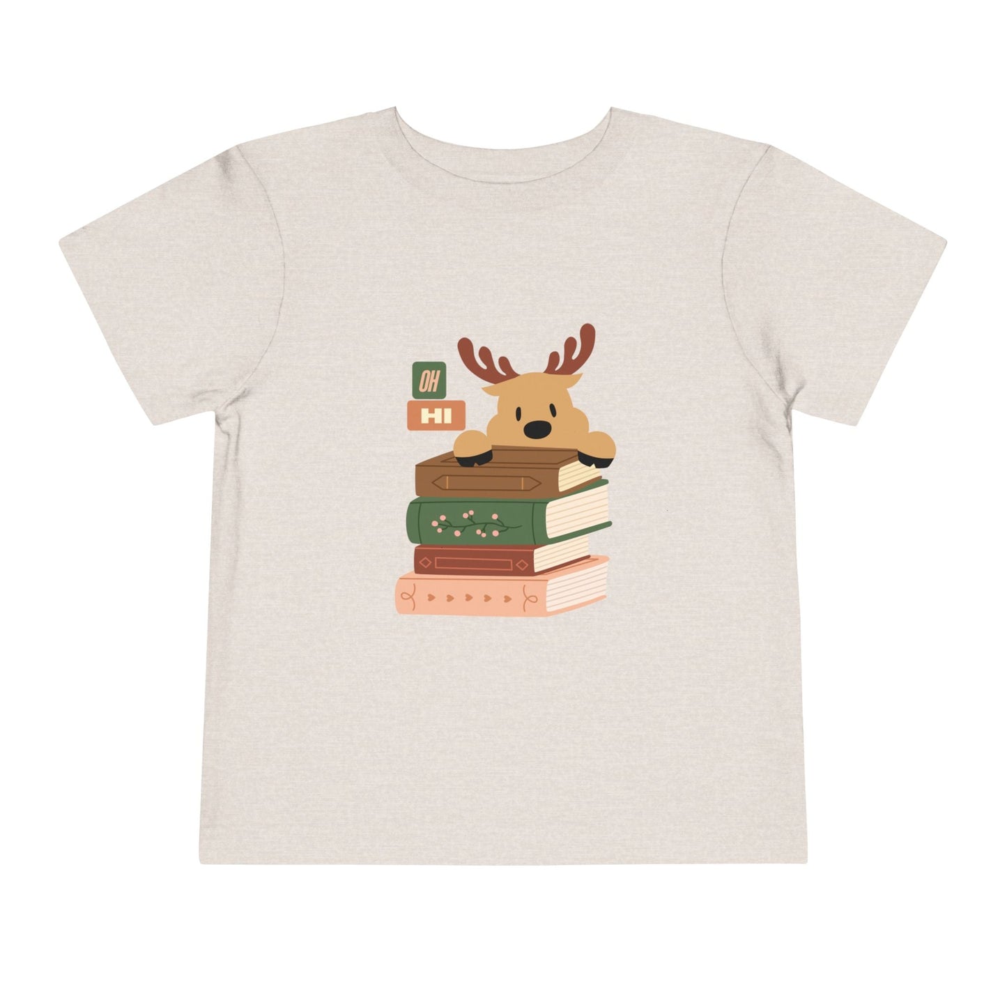 Tan/gray toddler t-shirt with a cartoon reindeer peeking over a stack of books, text 'oh hi', on a white background