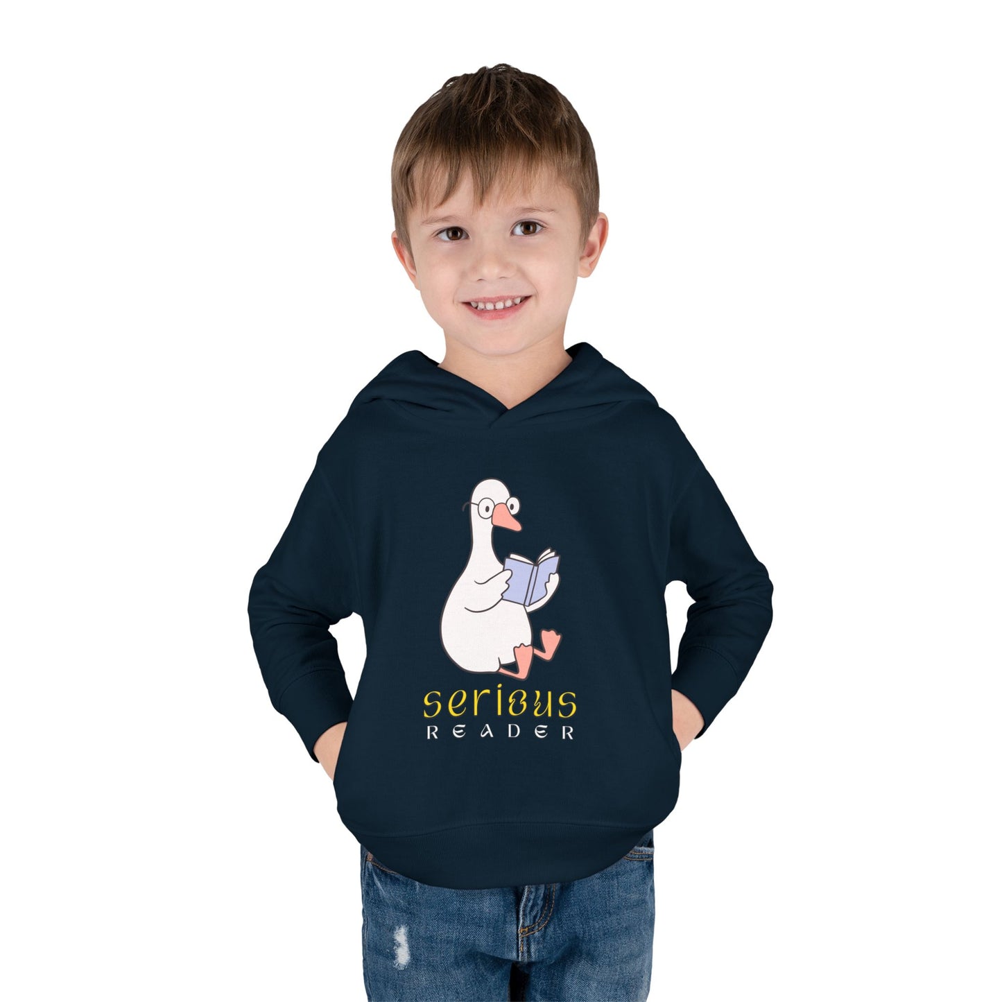 Boy wearing a navy blue toddler hoodie with a cartoon goose reading a book and 'Serious Reader' text 