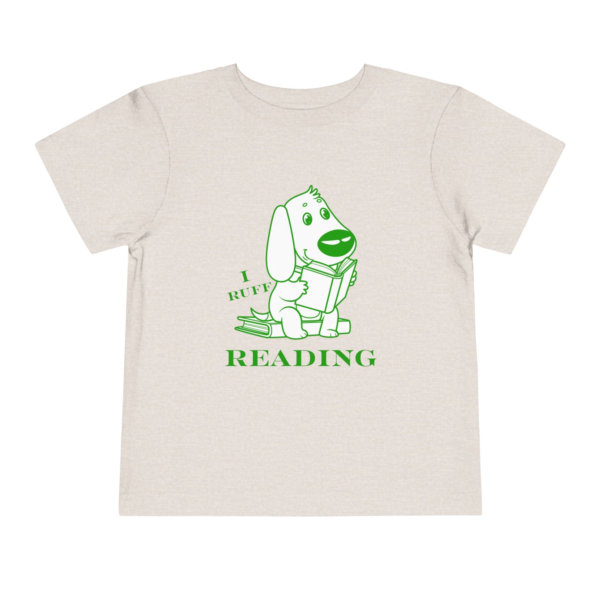 Beige toddler t-shirt with green and white graphic of a dog reading a book and text 'I RUFF READING'