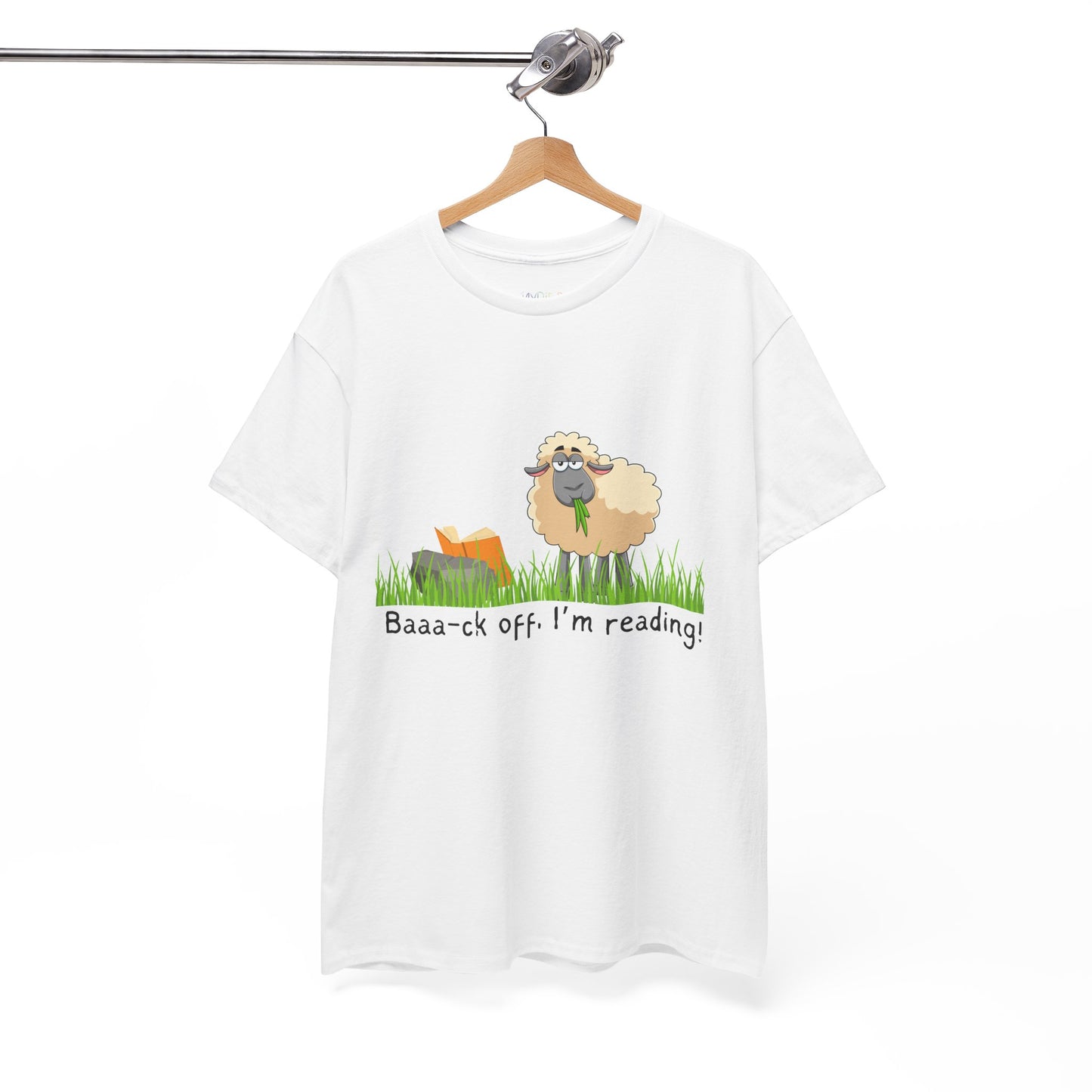 White t-shirt with a sheep munching grass and reading a book propped up on a rock, text 'Baaa-ck off. I'm Reading!'