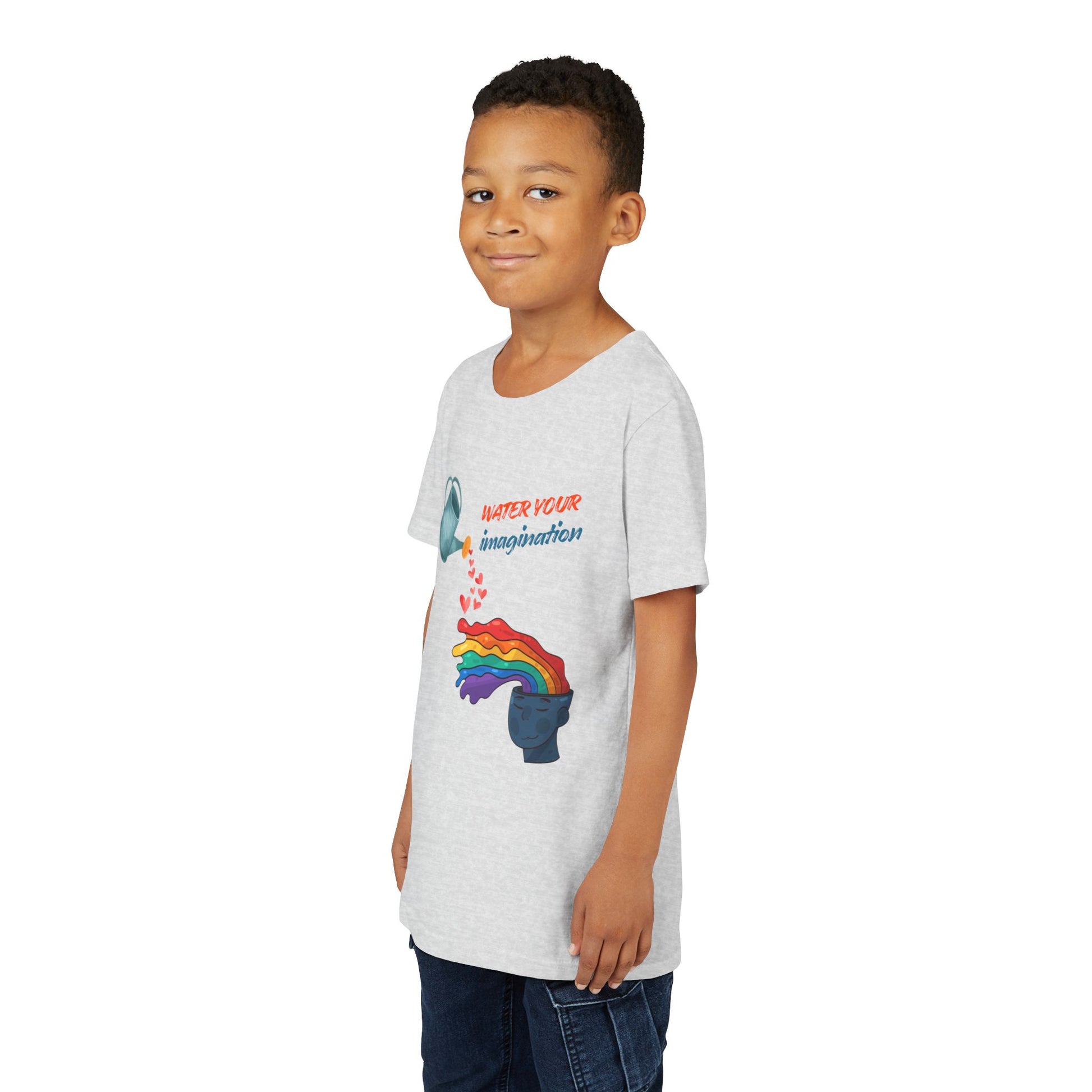 Boy wearing a light gray t-shirt with watering can pouring hearts into a watercolor rainbow brain with text 'Water your imagination' 