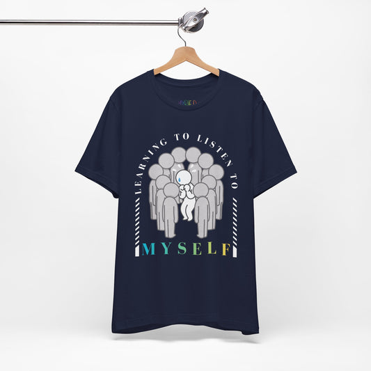 Navy blue t-shirt with graphic design with a figure hunched in the center of several other figures and text 'Learning To Listen To MYSELF'