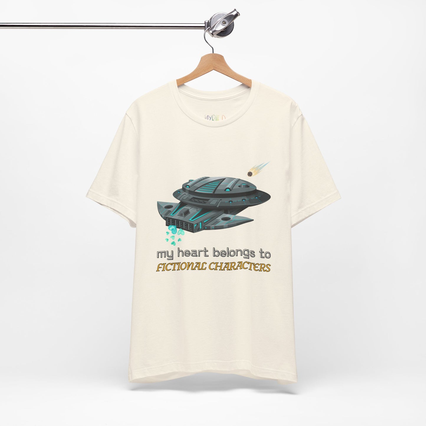Beige t-shirt with a spaceship and text 'My Heart Belongs To Fictional Characters'