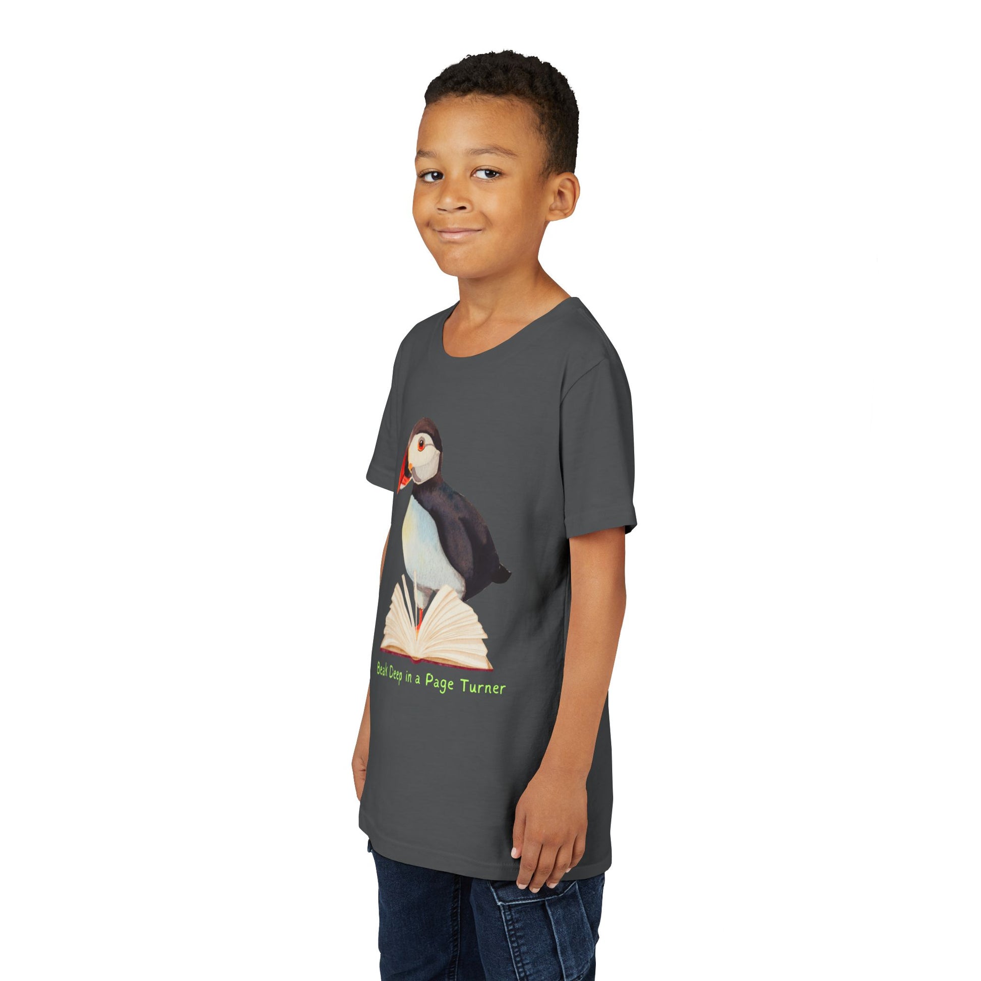 Boy wearing a dark gray t-shirt with a puffin, open book and text 'Beak Deep in a Page Turn' 