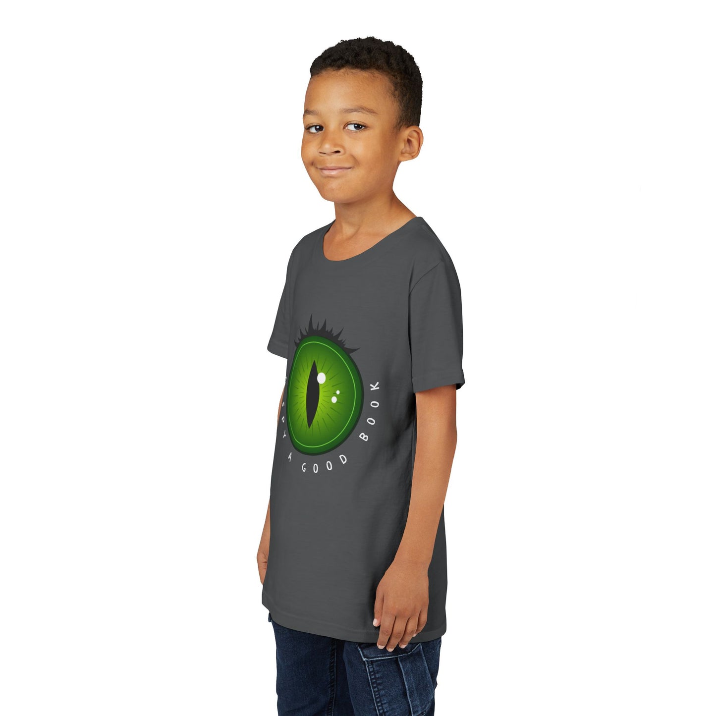 Boy wearing a gray t-shirt with a green monster eye graphic and text 'I SPY A GOOD BOOK'