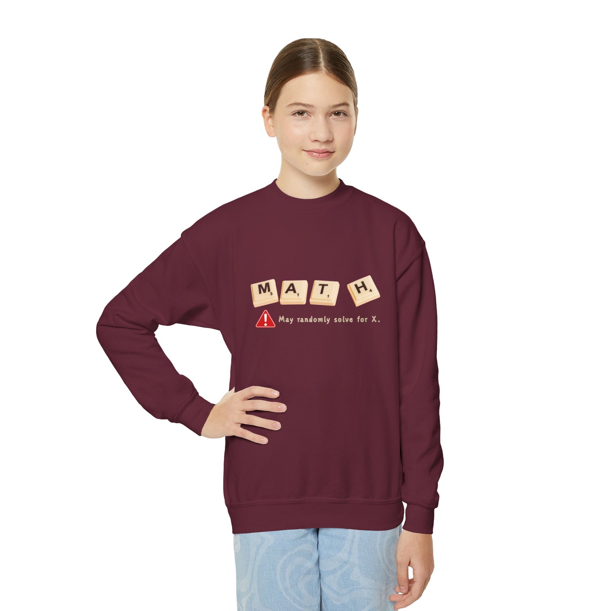 Girl wearing a maroon sweatshirt with 'MATH' game tiles and text 'May randomly solve for x'