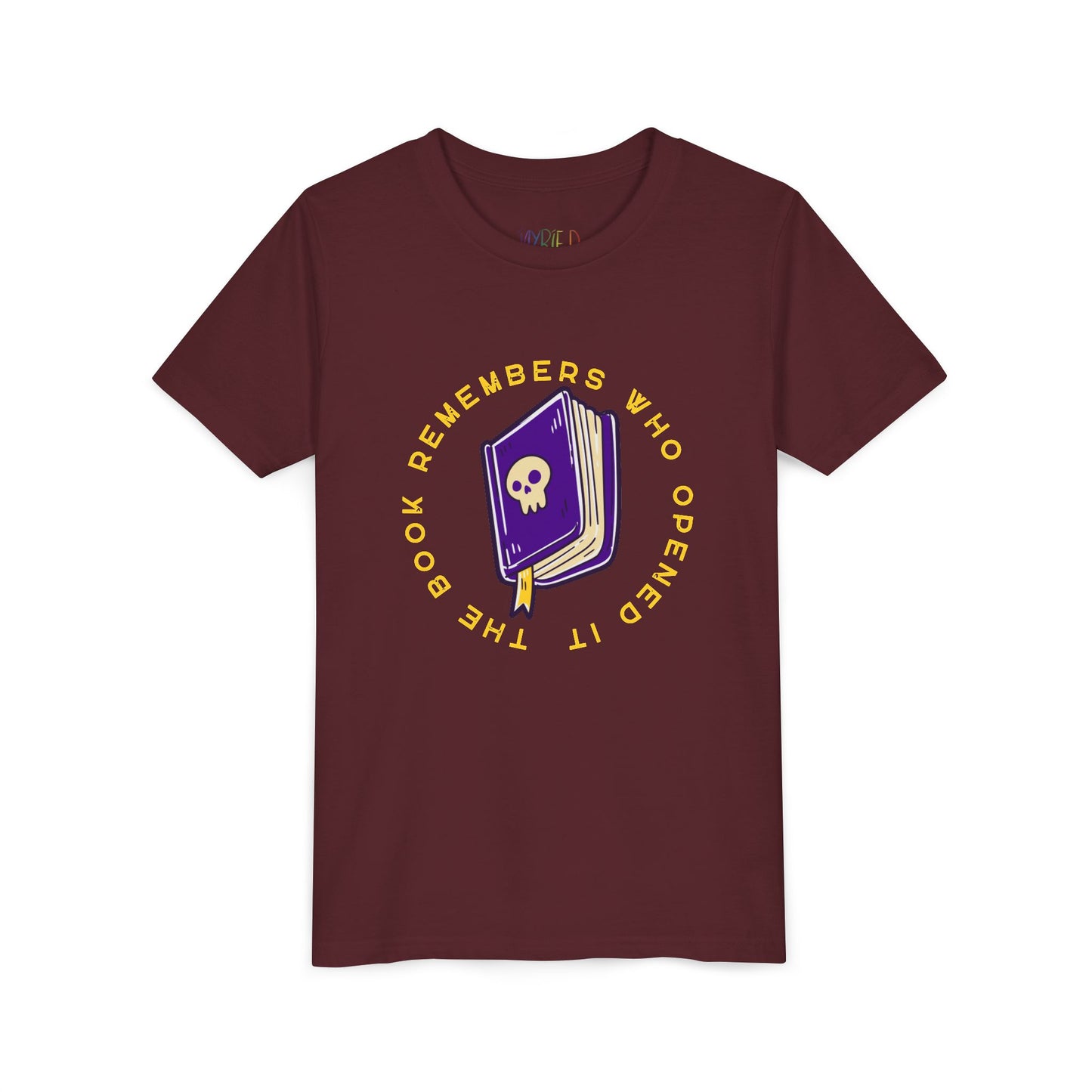 Maroon t-shirt with a purple book graphic, featuring a skull on the cover and surrounded by yellow text 'The Book Remembers Who Opened It'