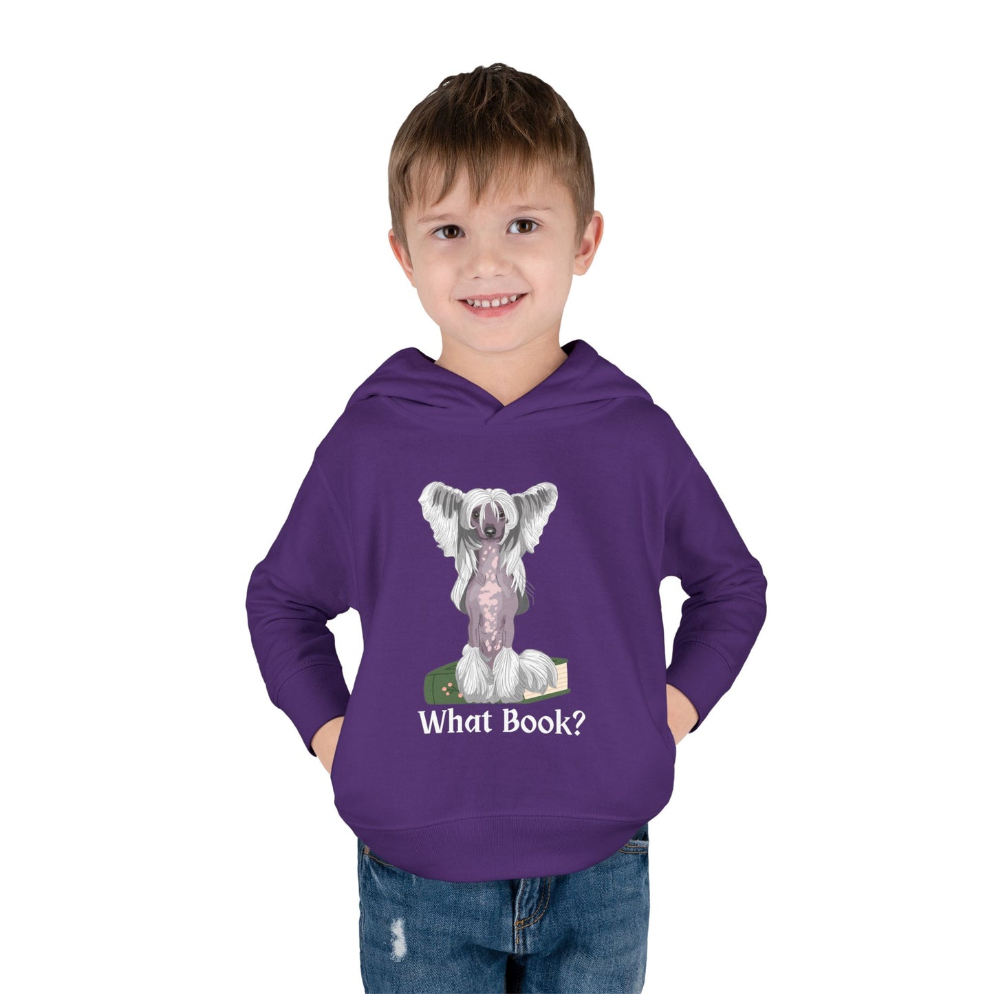 Boy wearing a purple toddler hoodie featuring a partially hairless dog perched on top of a book and text 'What Book' on white background