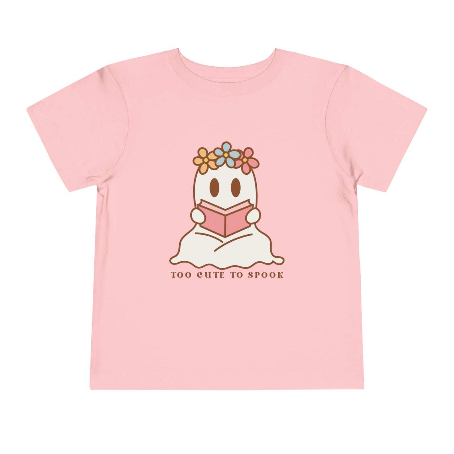 Pink toddler t-shirt with a ghost reading a book and 'Too Cute to Spook' text on a white background
