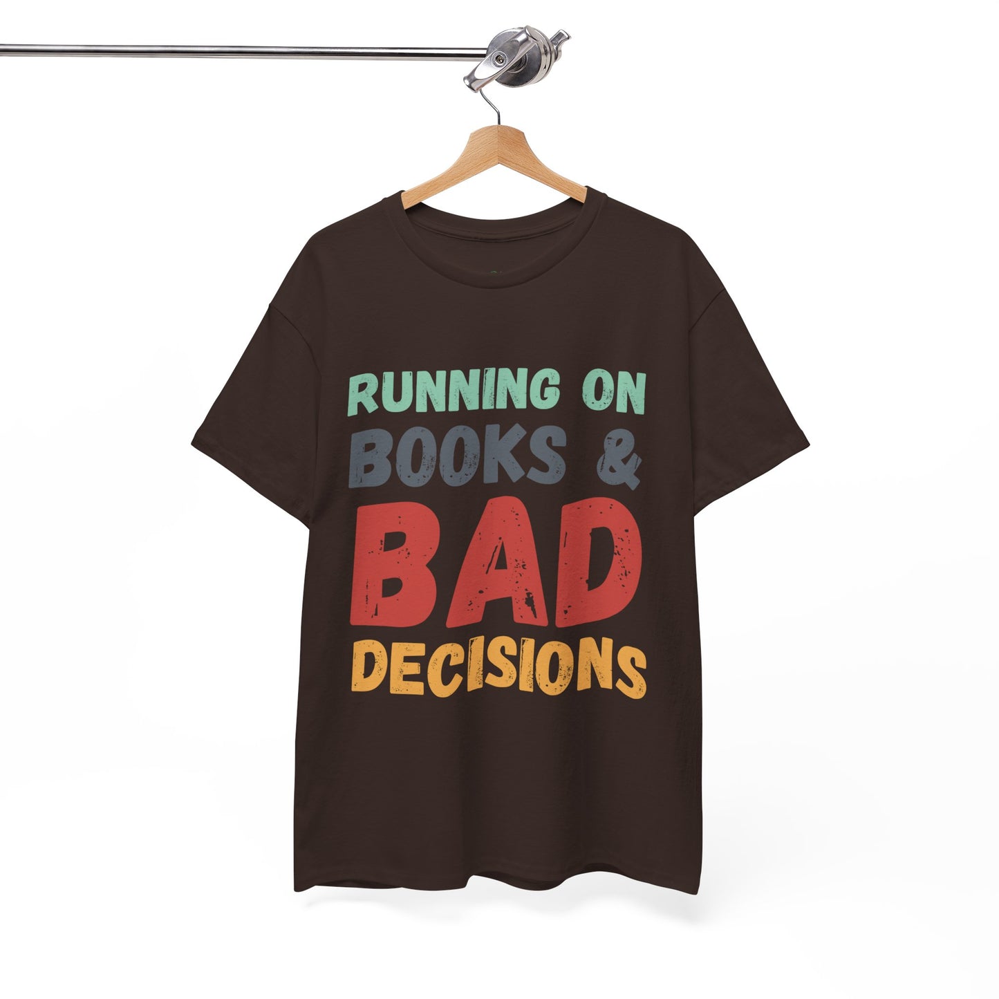 Brown t-shirt with colorful retro text 'Running on Books & Bad Decisions' 