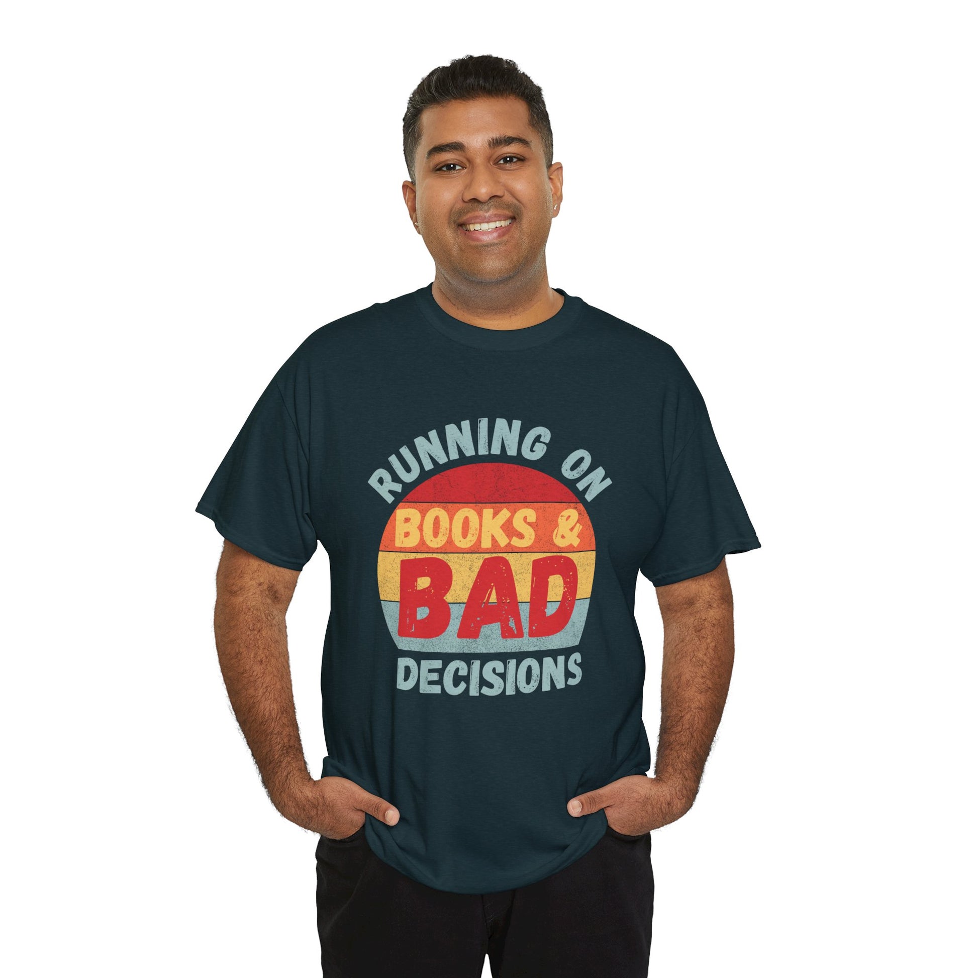 Man wearing a dark (midnight) t-shirt with colorful retro striped sunset and text 'Running On Books & Bad Decisions' 