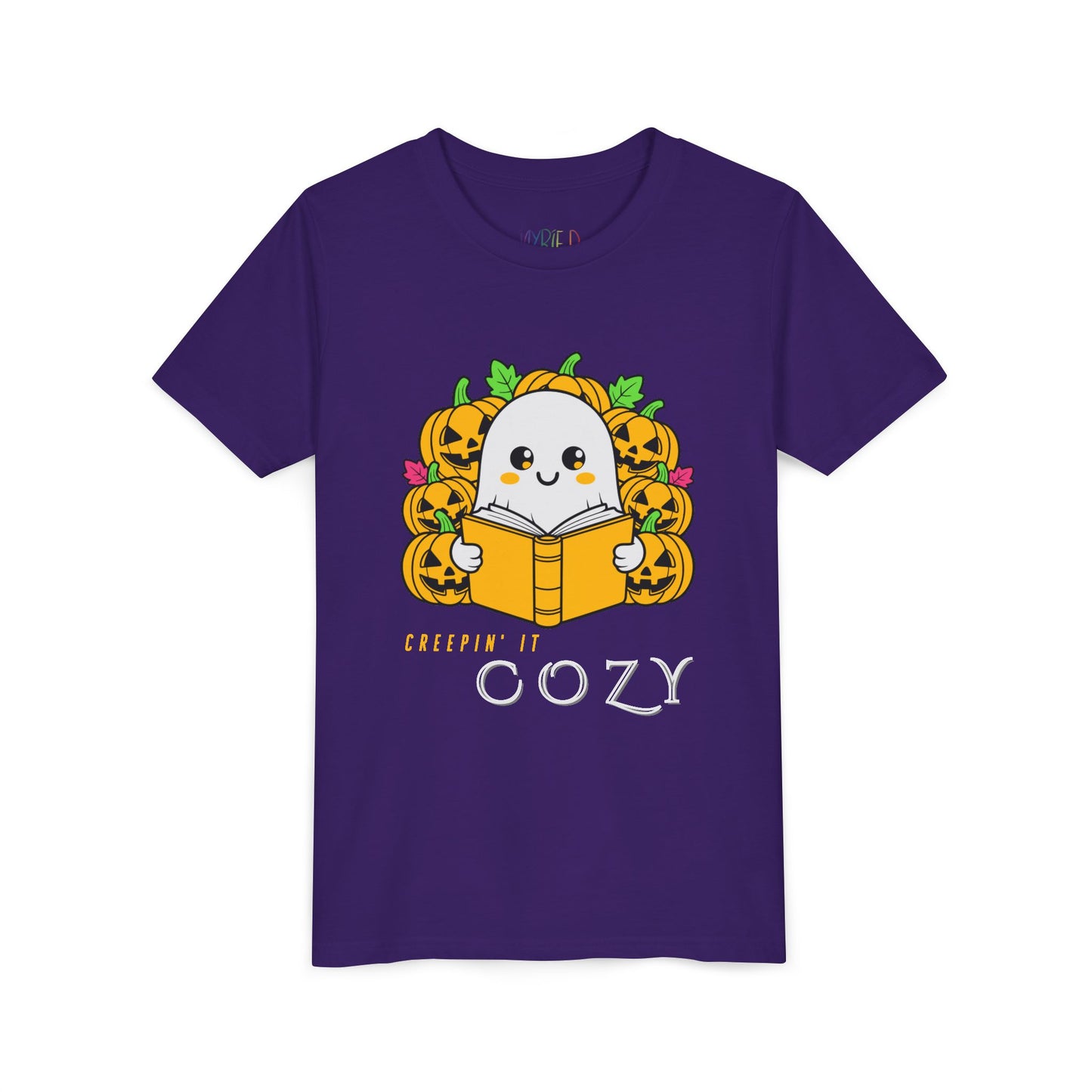 Purple t-shirt with a ghost reading a book in a pumpkin patch with text 'Creepin' It Cozy'