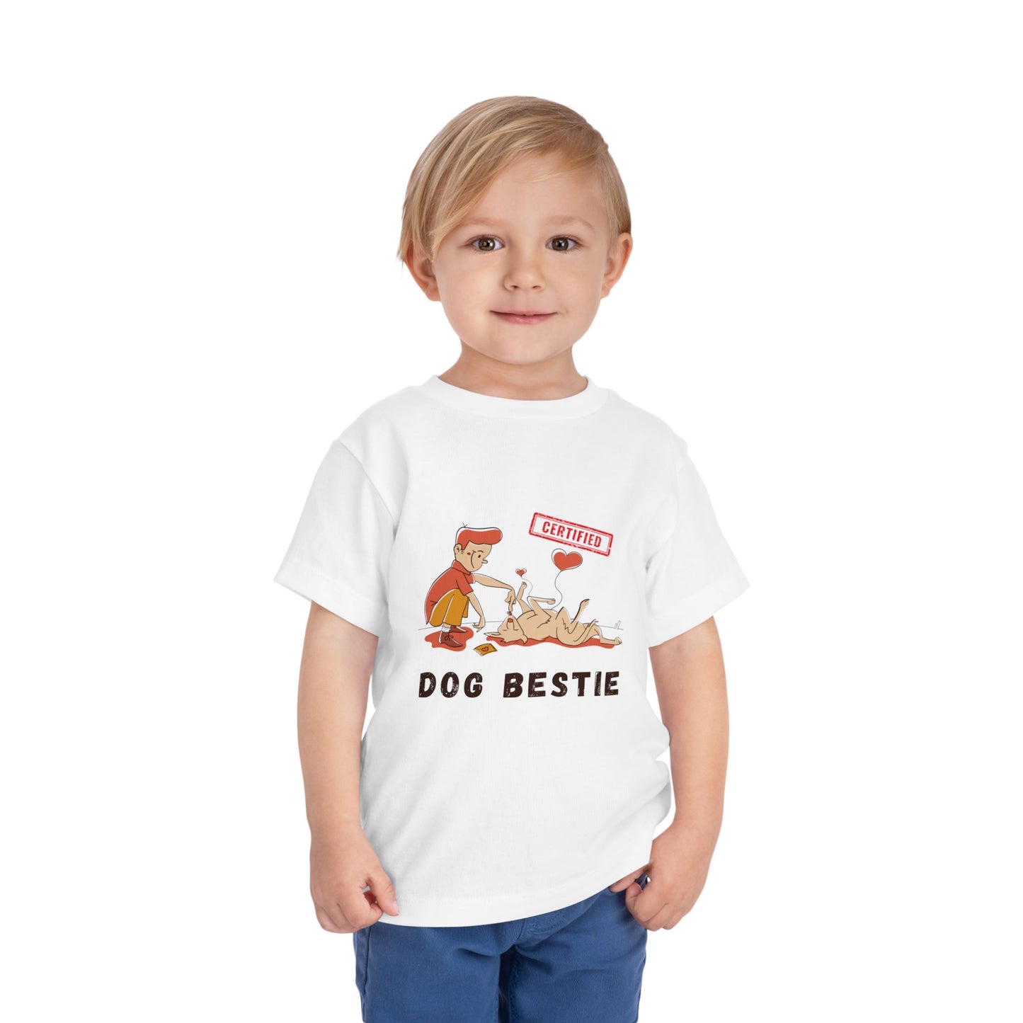 Child wearing a white toddler t-shirt with cartoon graphic and a boy and his dog with 'Dog Bestie' text