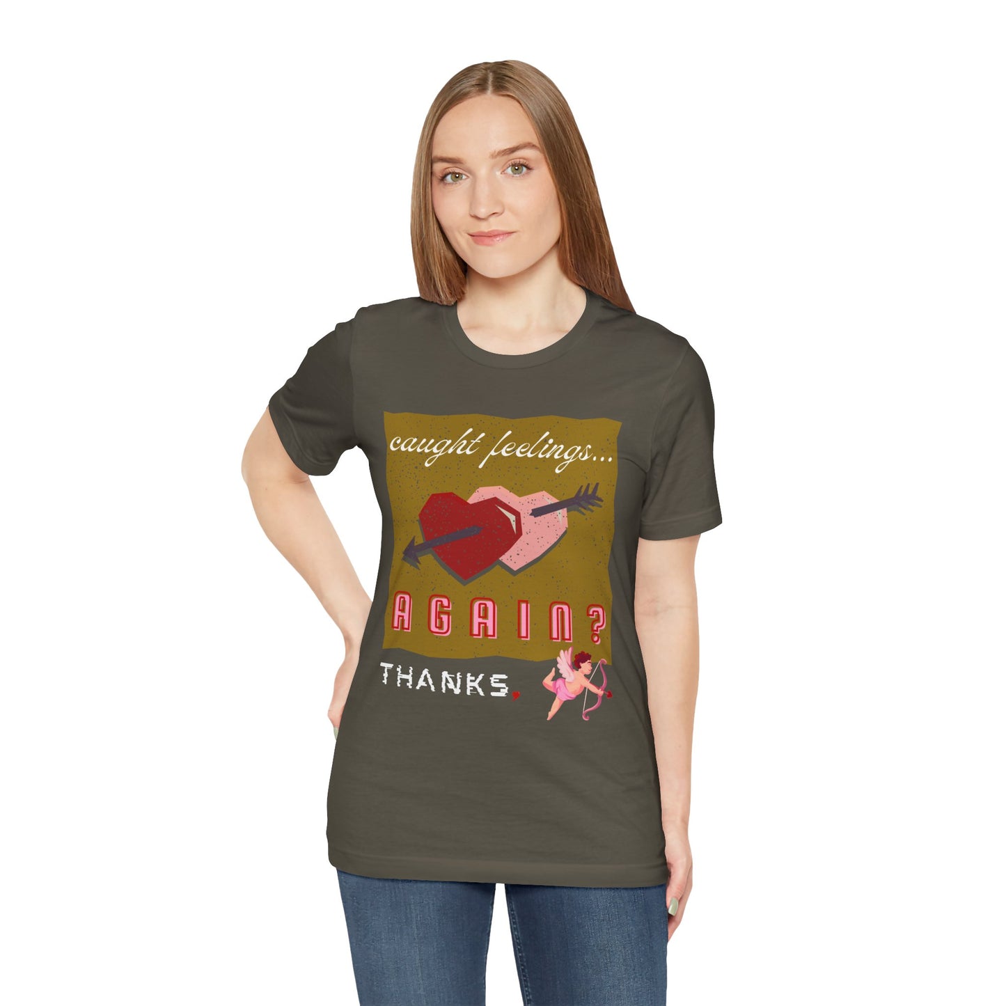 Woman wearing a military green t-shirt with double heart graphic design and text 'Caught Feelings AGAIN? Thanks,' followed by a picture of cupid