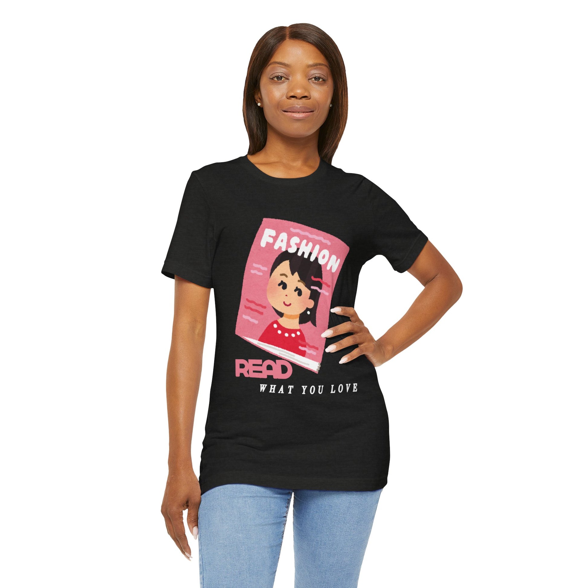 Woman wearing a black t-shirt with a graphic design of a girl on a fashion magazine and text 'Read What You Love' 